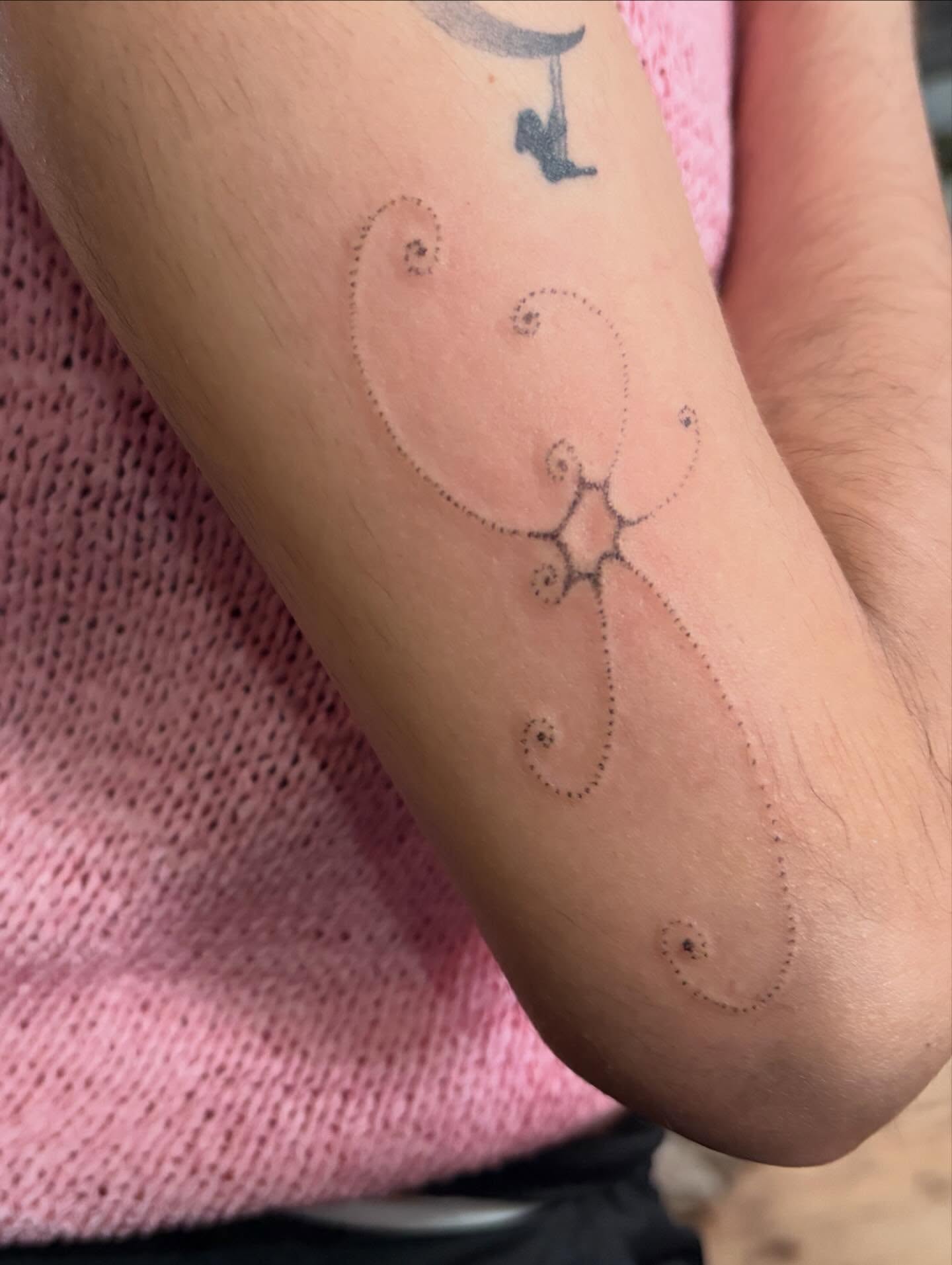 Abstract design dotwork tattoo on the forearm by kari