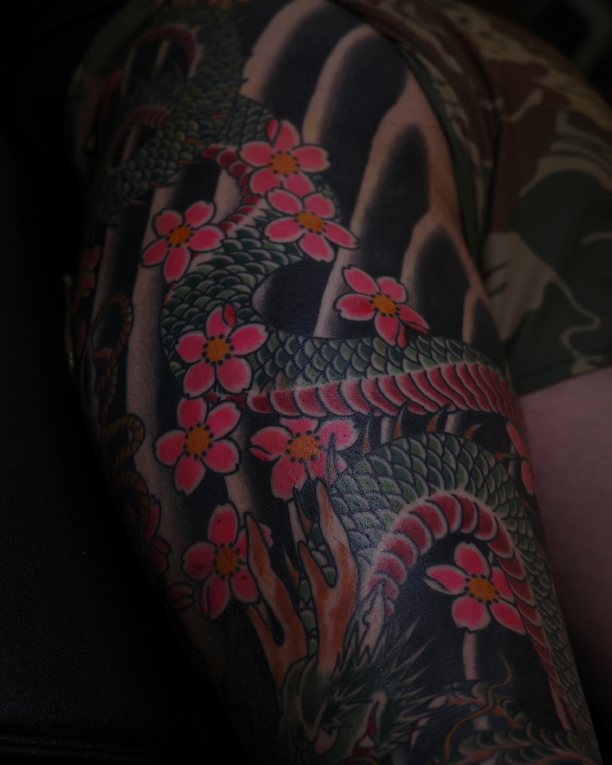 Dragon and cherry blossoms japanese irezumi tattoo on the upper arm by Sequoia Rose, Portland, Oregon