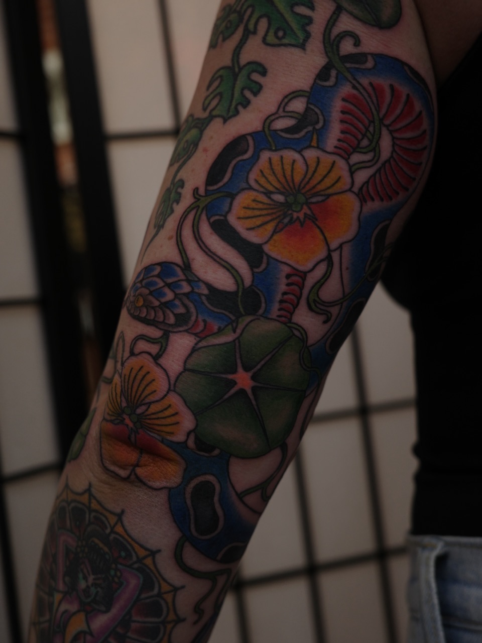 Floral arrangement American traditional tattoo on the forearm by Sequoia Rose, Portland, Oregon