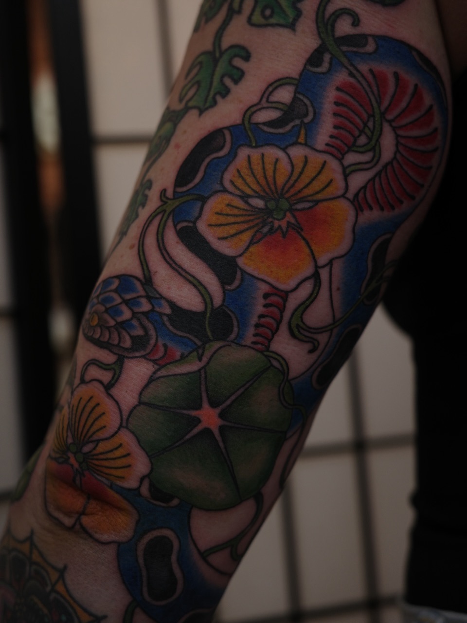 Floral design American traditional tattoo on the forearm by Sequoia Rose, Portland, Oregon