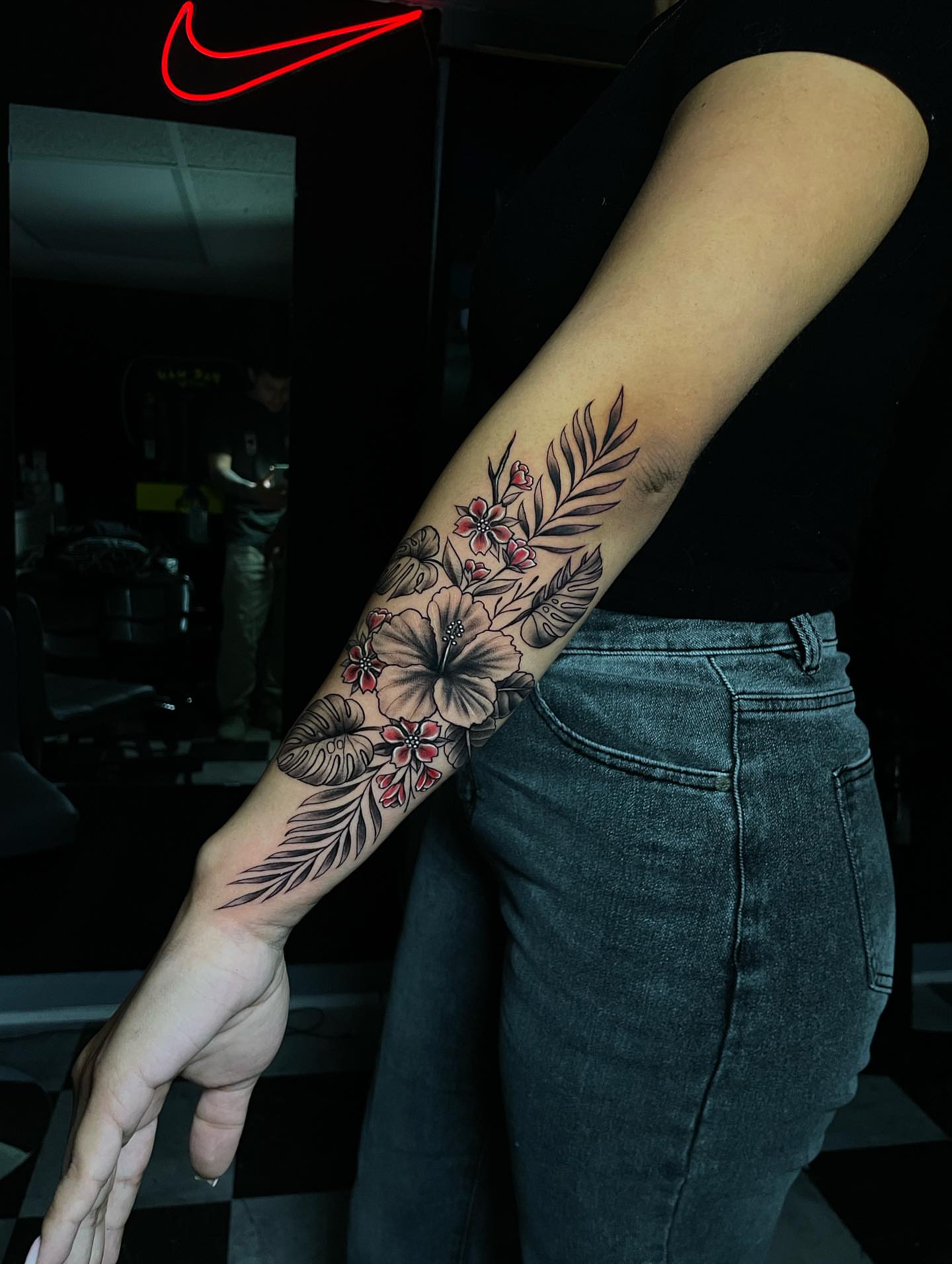 Floral arrangement black and grey tattoo on the forearm by Nikko