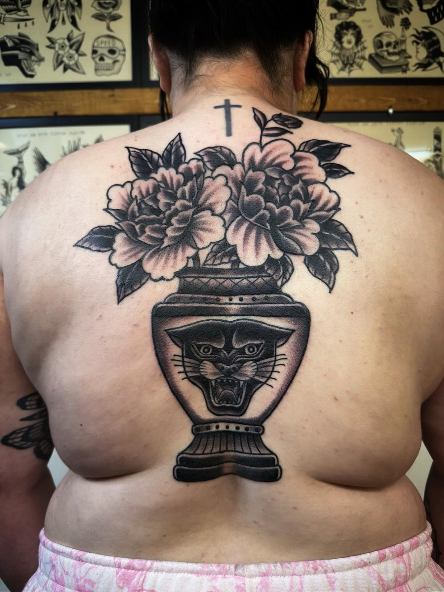 Panther vase with flowers American traditional tattoo on the back by Trav, Bayville, New Jersey