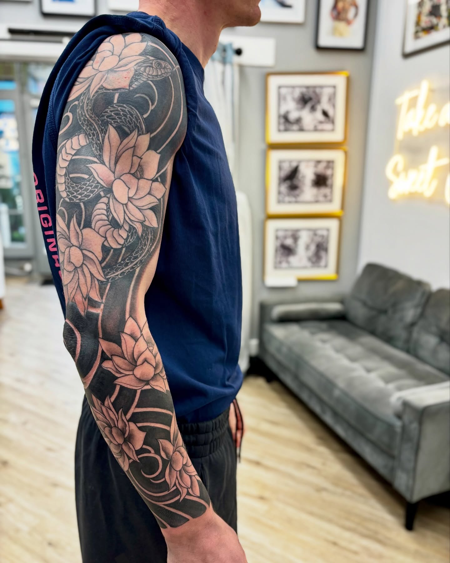 Snake and lotus japanese irezumi tattoo on the upper arm by Ruth Ormsby-Ashworth