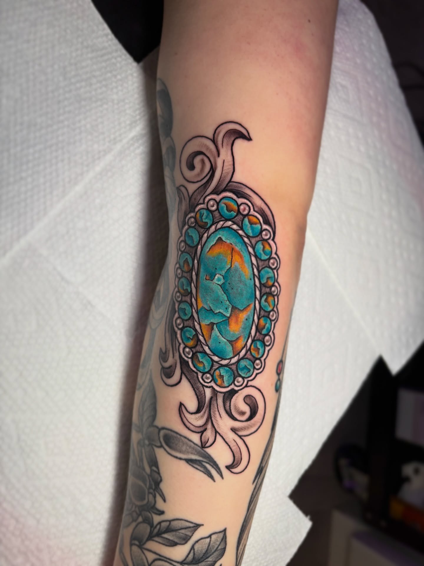 Gemstone American traditional tattoo on the forearm by Bunny Noel