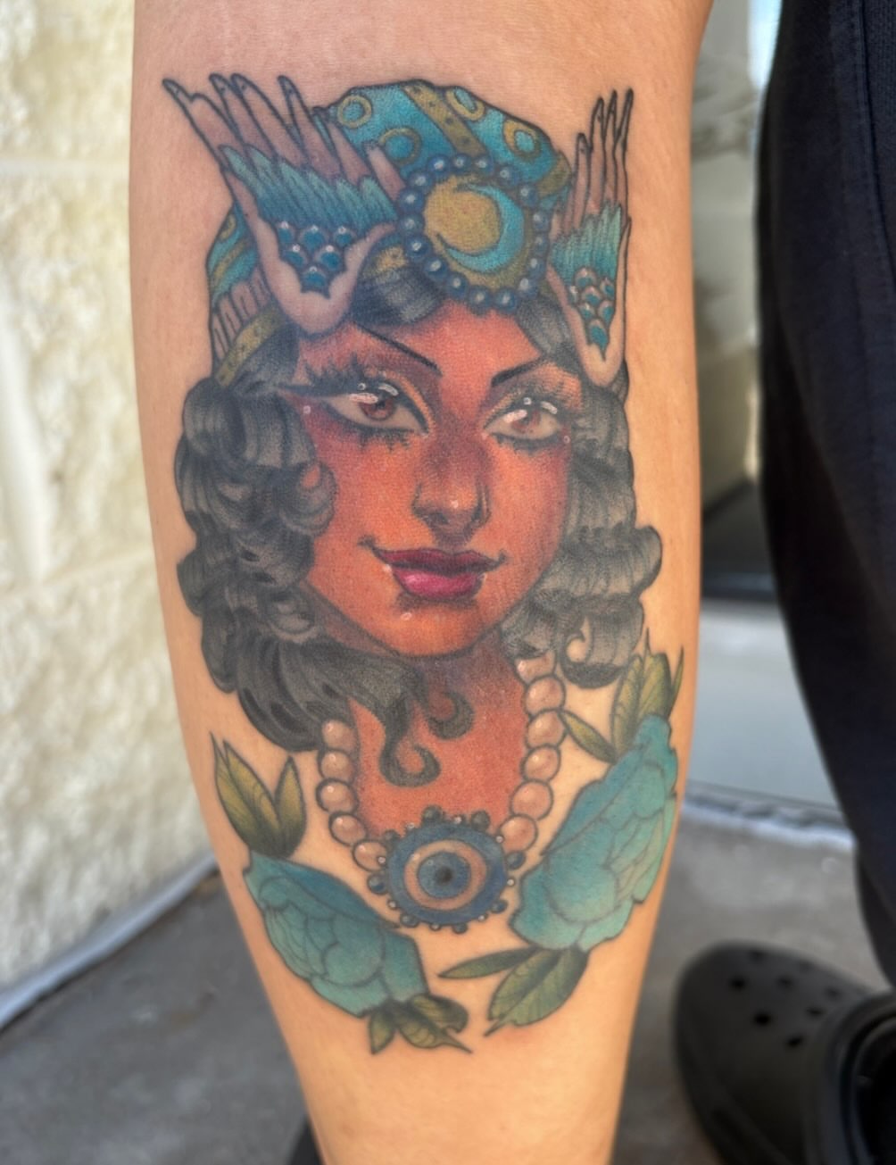 Woman with wings American traditional tattoo on the forearm by Gabby