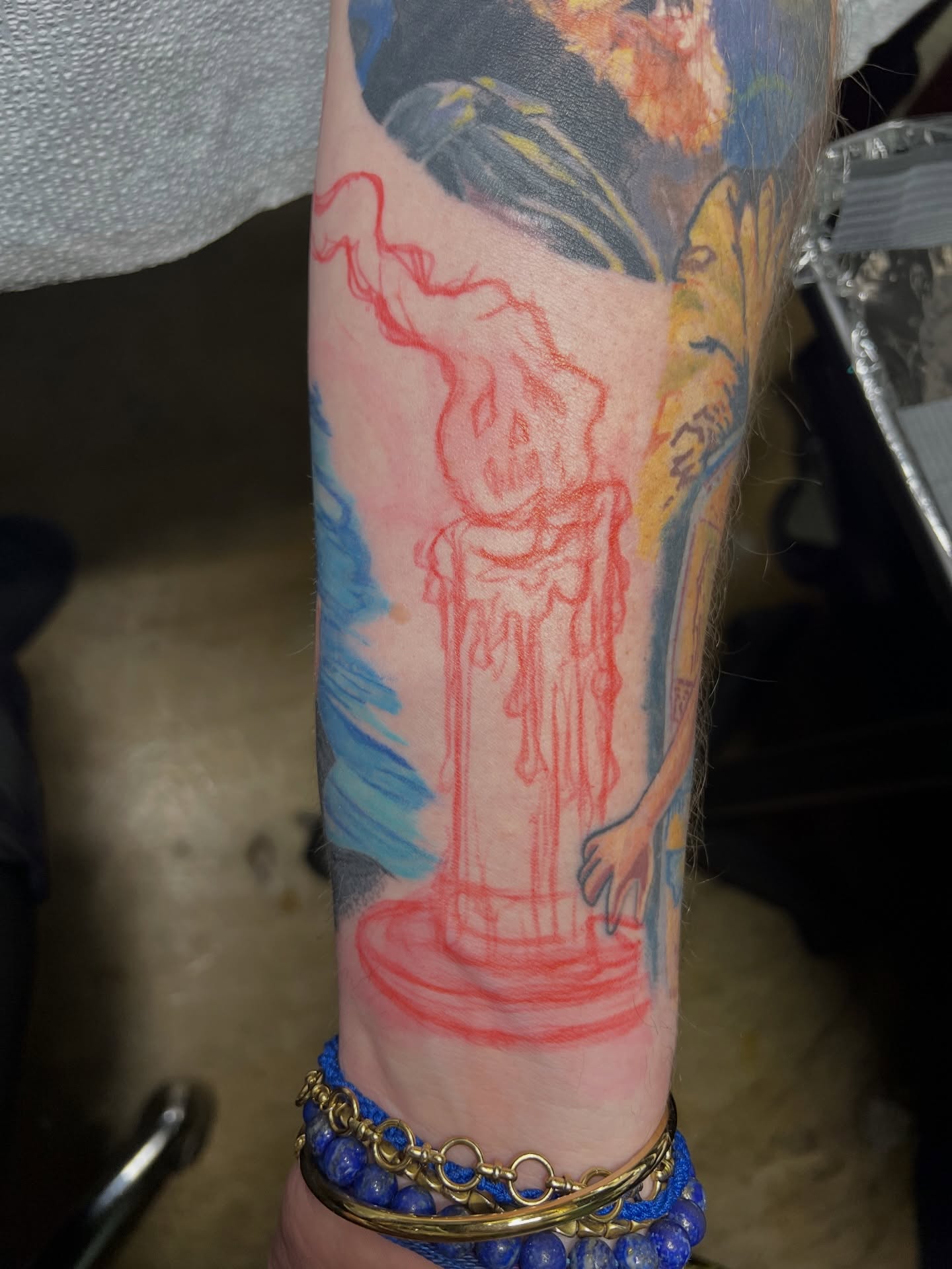 Skull and candle dotwork tattoo on the forearm by Alex Santaloci