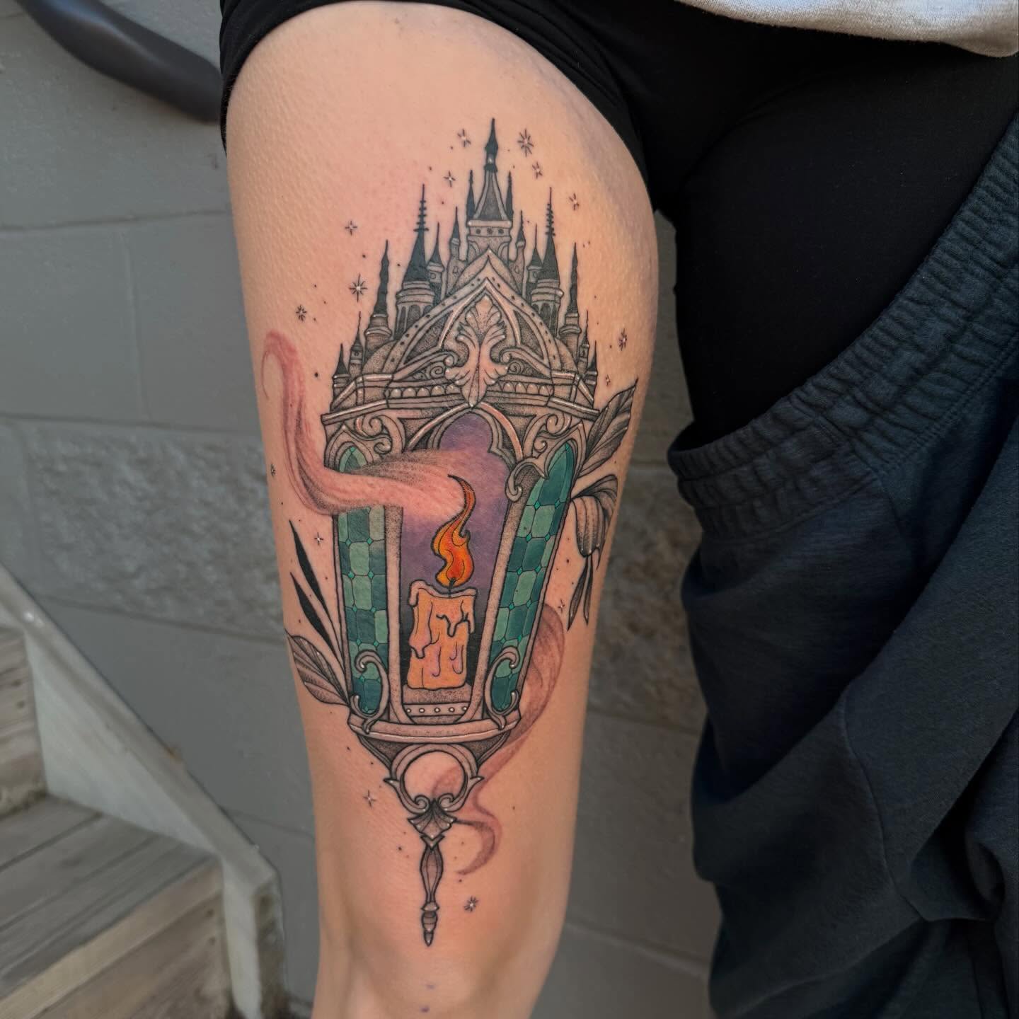 Castle and candle new school tattoo on the thigh by Erica Rose π€