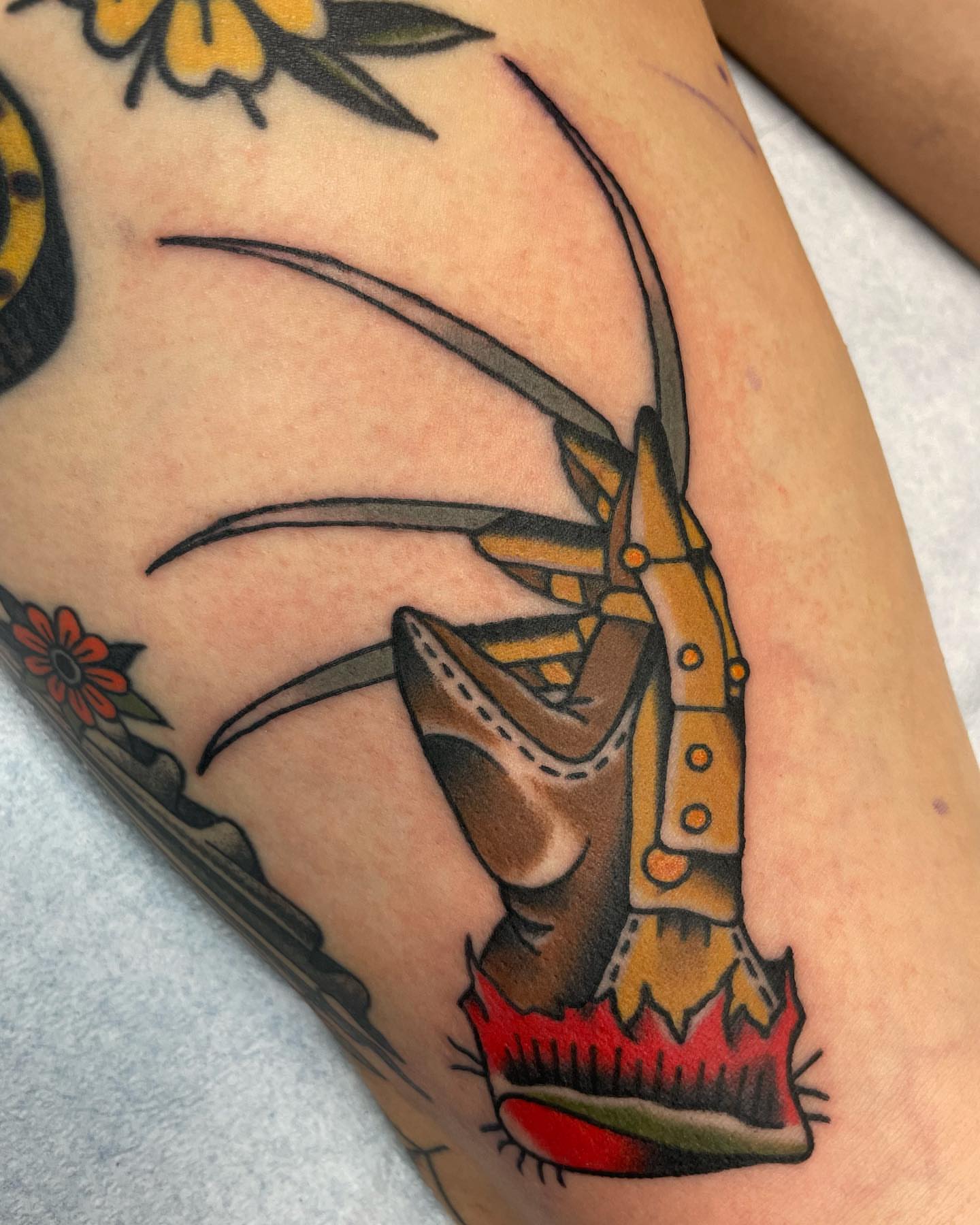 Cowboy boot and spurs American traditional tattoo on the forearm by Gerald Bellmore