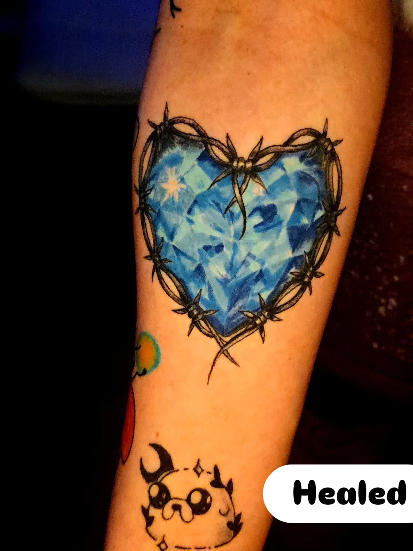 Barbed wire heart geometric tattoo on the forearm by Karley Michelle Moody