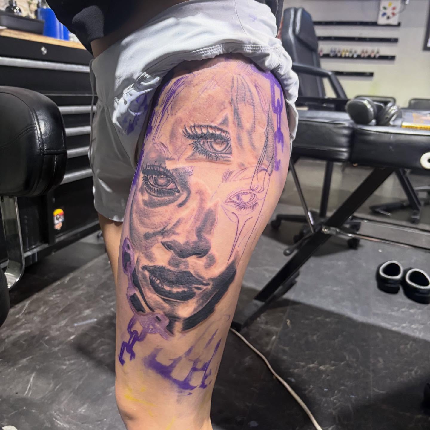 Portrait realism tattoo on the thigh by D. Davis