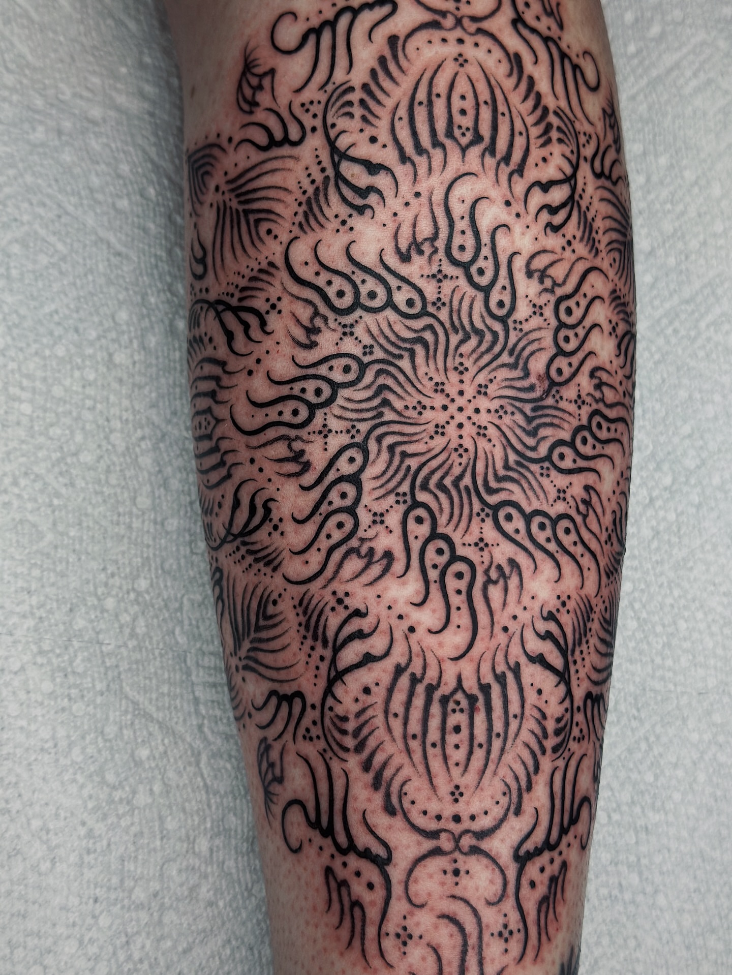 Abstract pattern dotwork tattoo on the forearm by Lauryn Jenesis