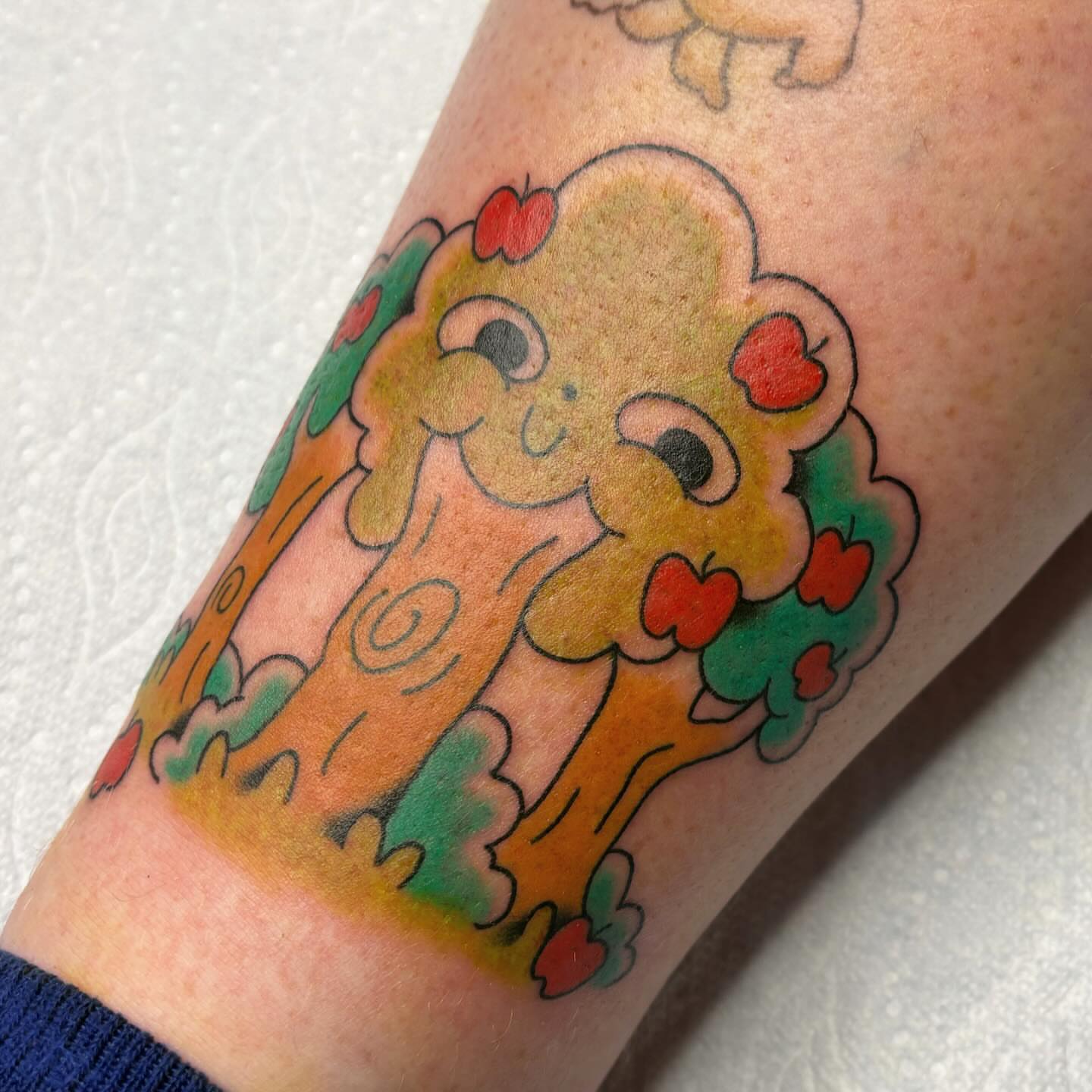 Cloud American traditional tattoo on the forearm by Harley, Denver, Colorado