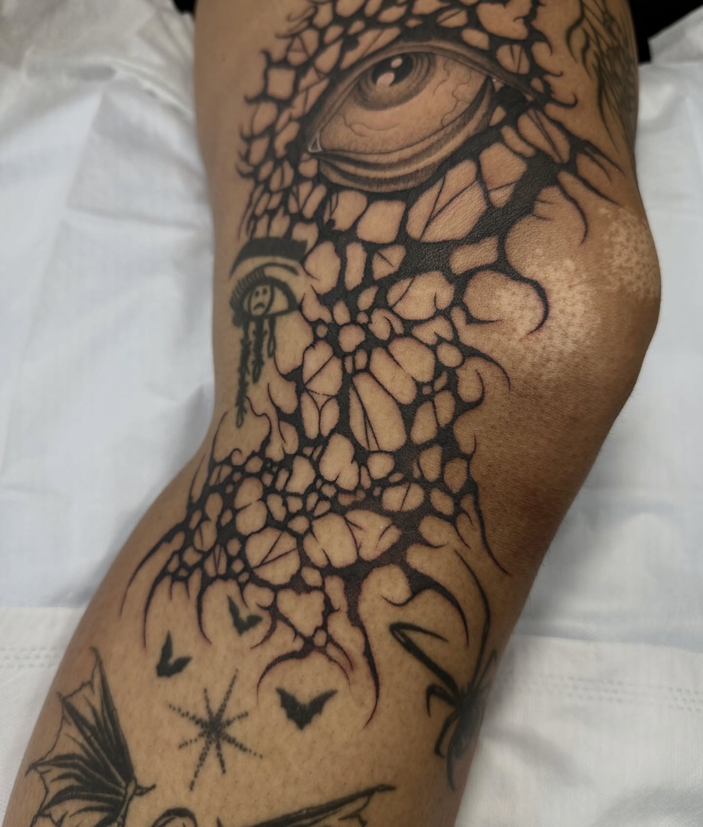 Eye and cracked stone realism tattoo on the forearm by Brooklyn Bailey