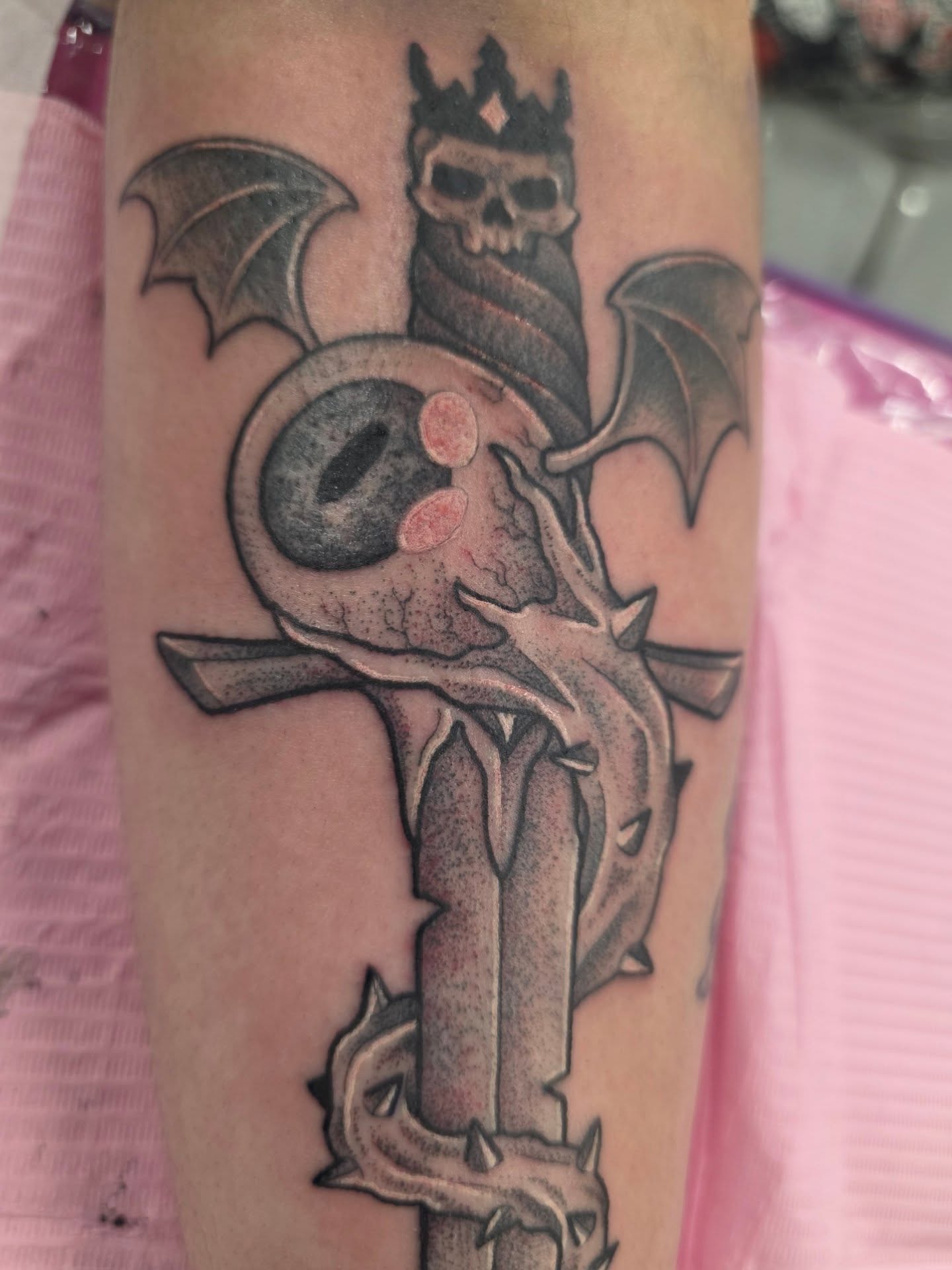 Cross with skull dark realism tattoo on the forearm by Mandy Rizzuto