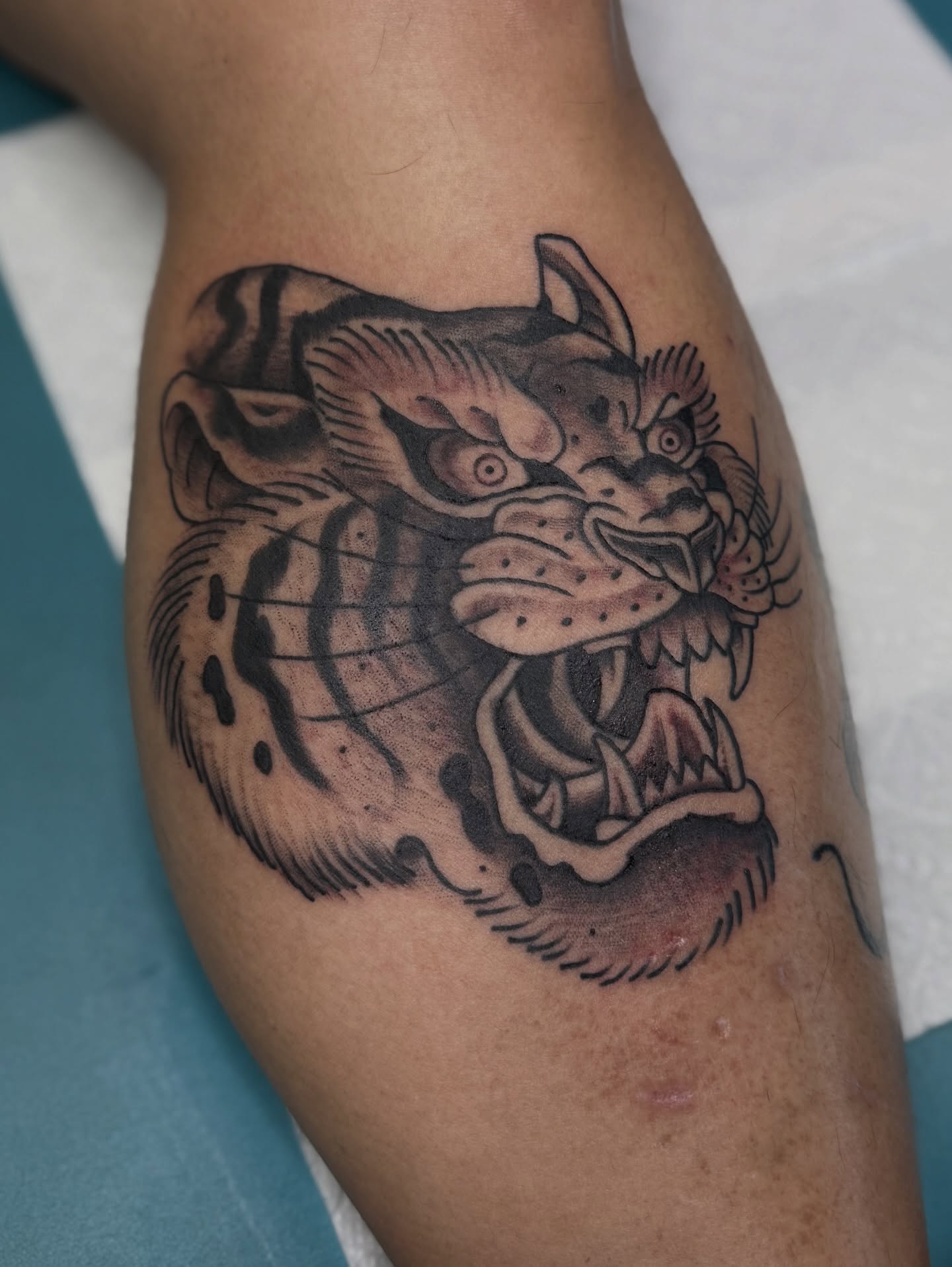 Demon American traditional tattoo on the thigh by Ramón Silva