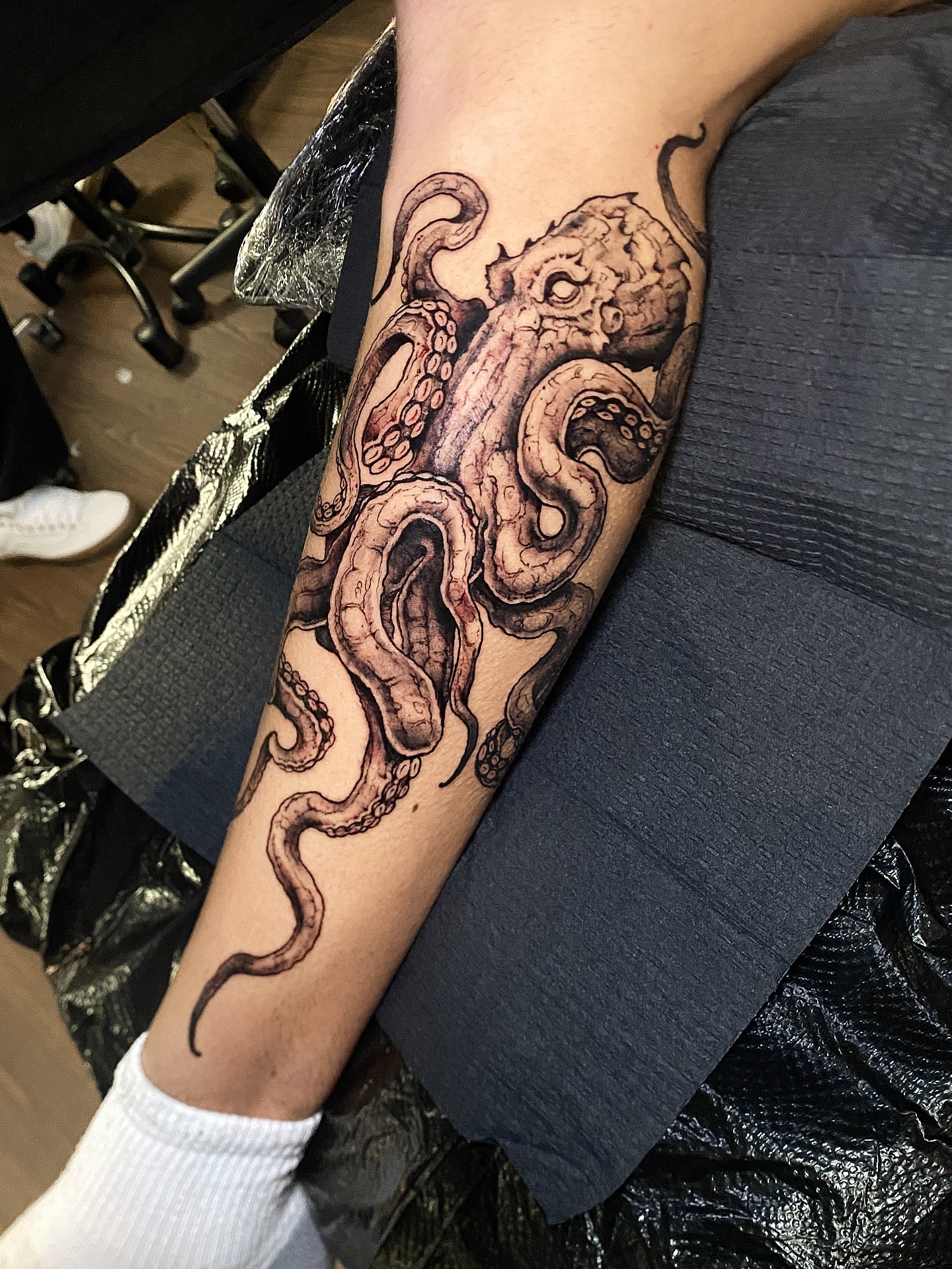 Octopus realism tattoo on the forearm by Adam Newton