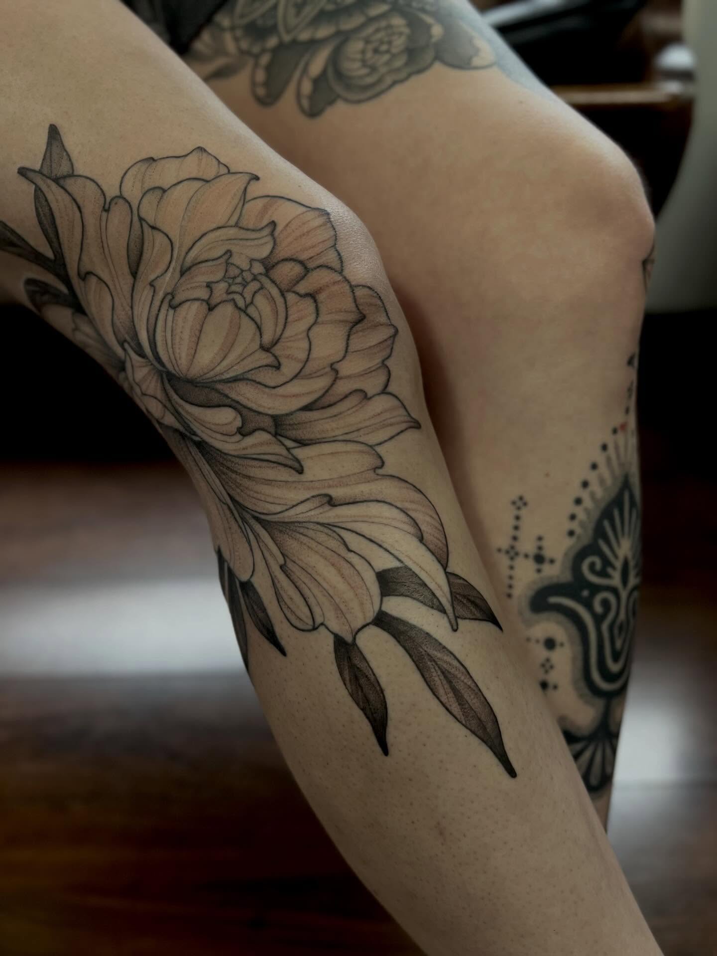 Peony black and grey tattoo on the forearm by Avrey Simone