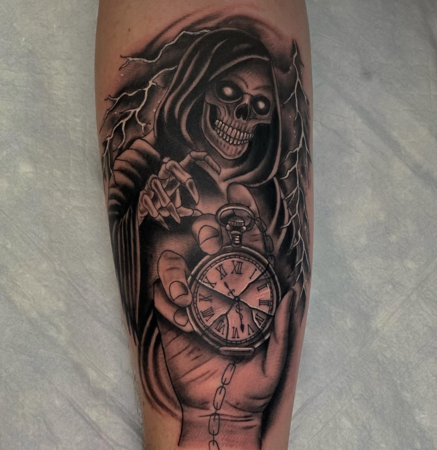 Grim reaper holding pocket watch realism tattoo on the forearm by Dylan Curry