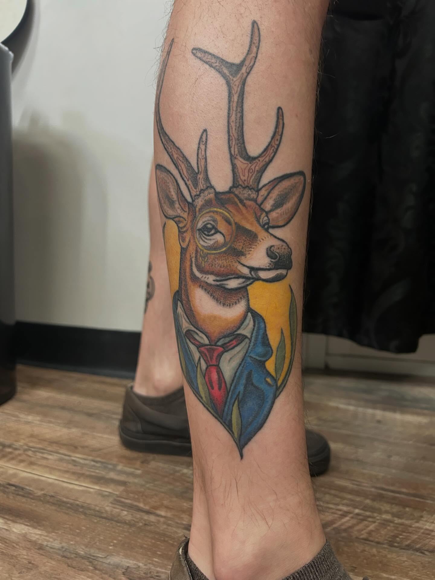 Deer in suit realism tattoo on the forearm by 𝔎𝔞𝔱𝔦𝔢 𝔚𝔦𝔱𝔱𝔴𝔢𝔯
