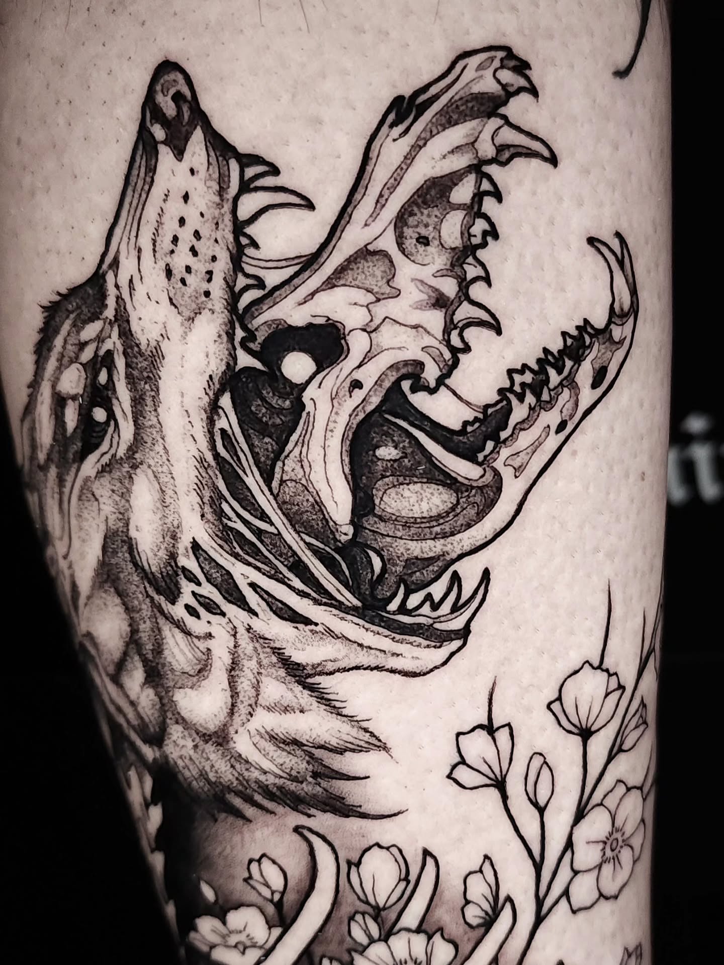 Wolf head black and grey tattoo on the forearm by Mario Romero