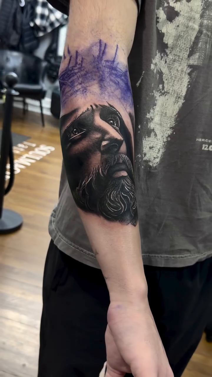 Portrait of a man realism tattoo by caleb coley
