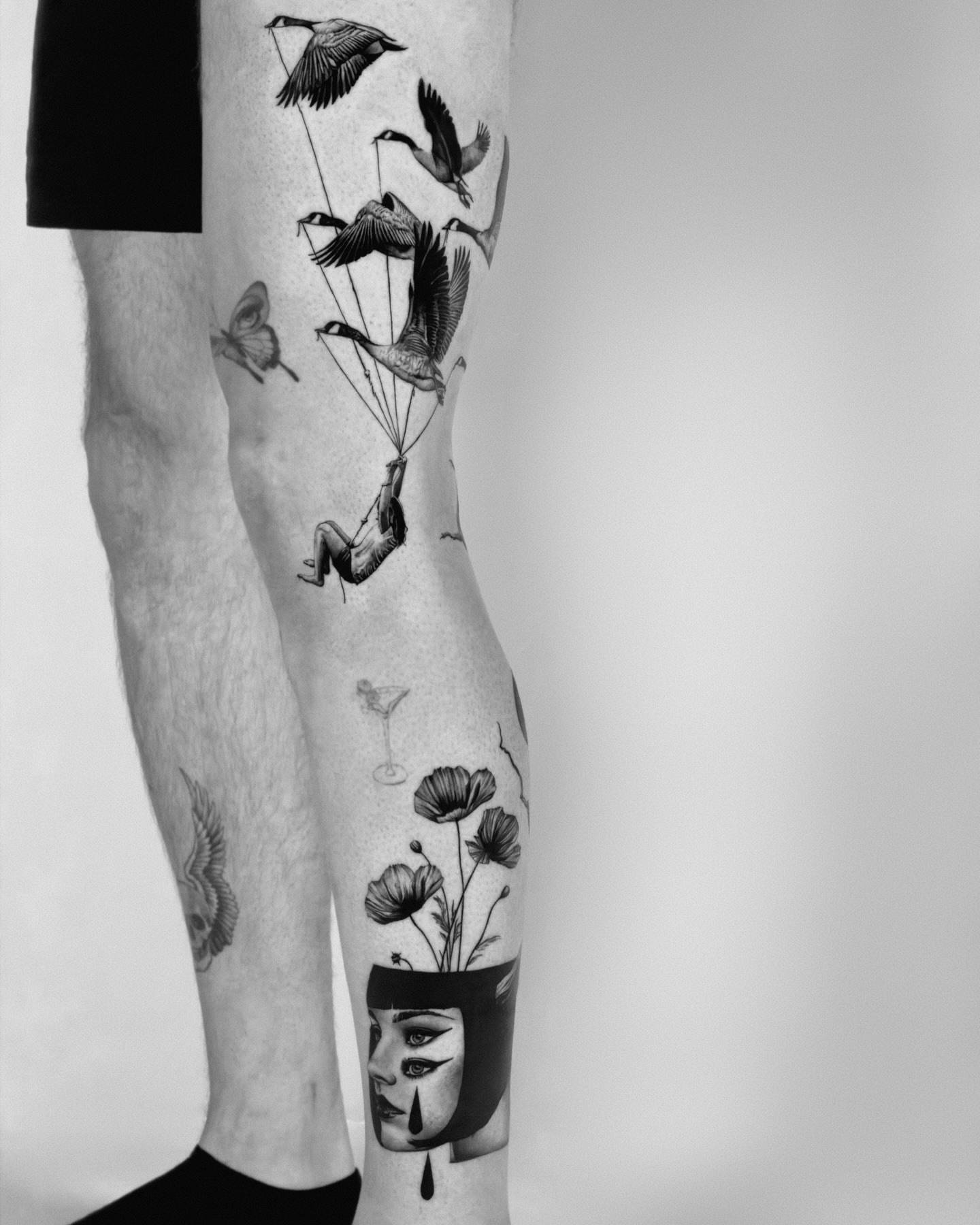 Bird and woman realism tattoo on the leg by Henko