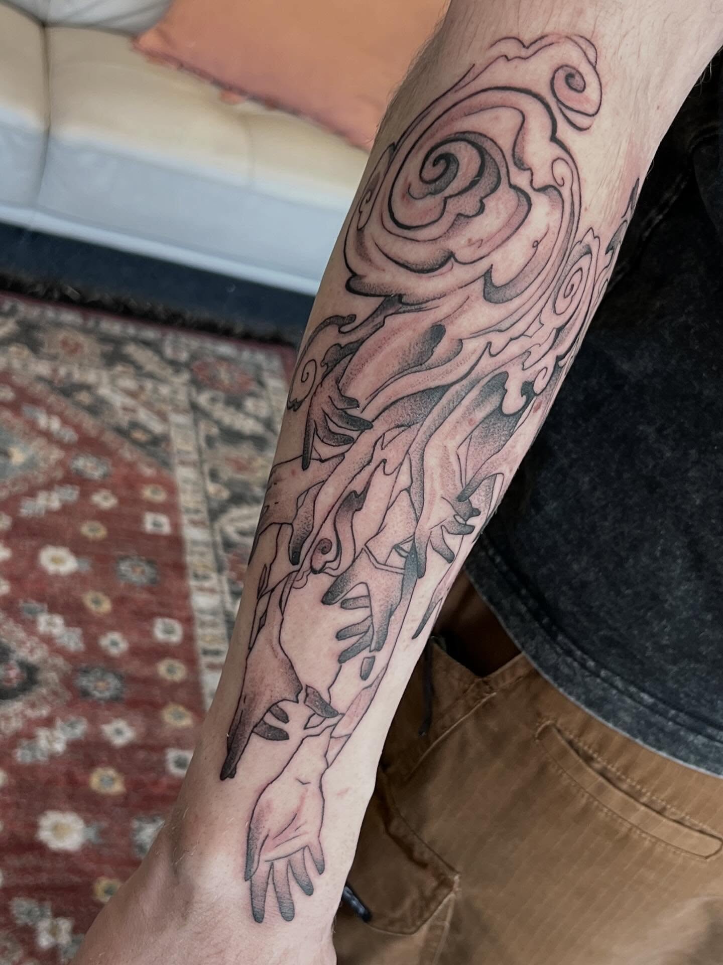 Fire and flame black and grey tattoo on the forearm by Callie πͺ