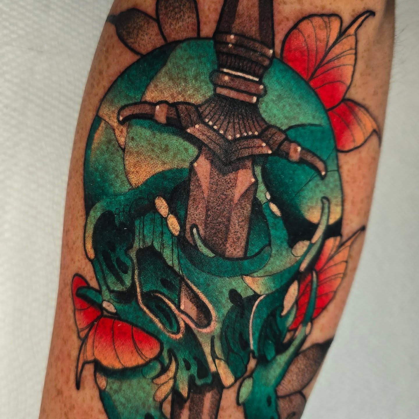 Skull and butterfly dotwork tattoo on the forearm by Justin Eldridge