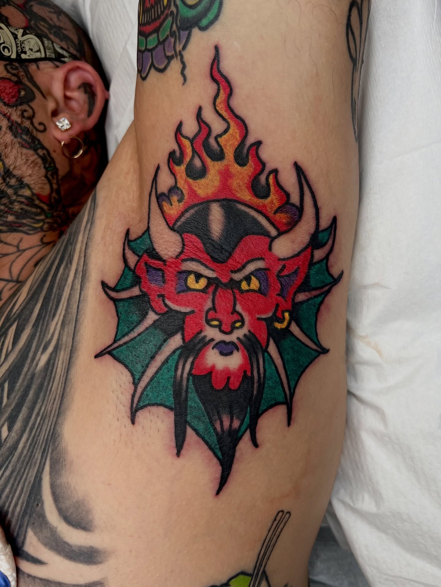 Demon head American traditional tattoo on the forearm by Nestor Zelaya
