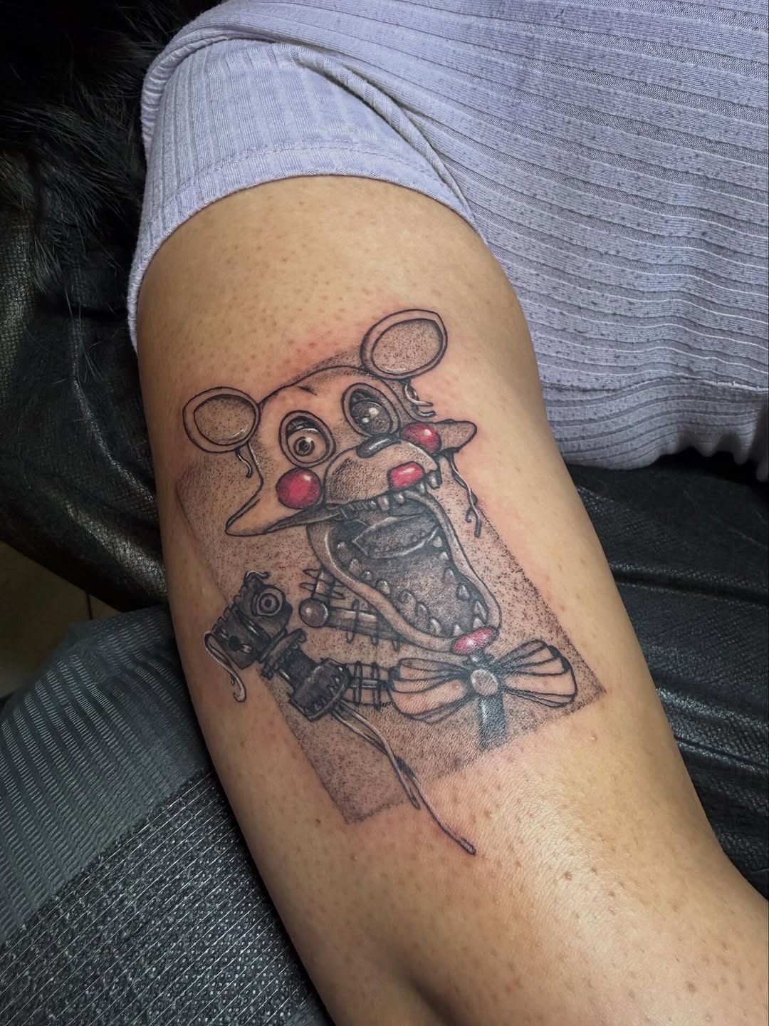 Creepy animatronic bear anime tattoo on the forearm by LooSid