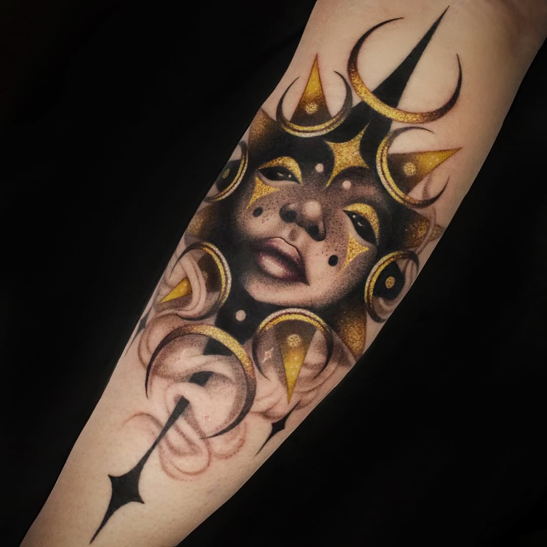Celestial face with moons and stars neo-traditional tattoo on the forearm by Galen