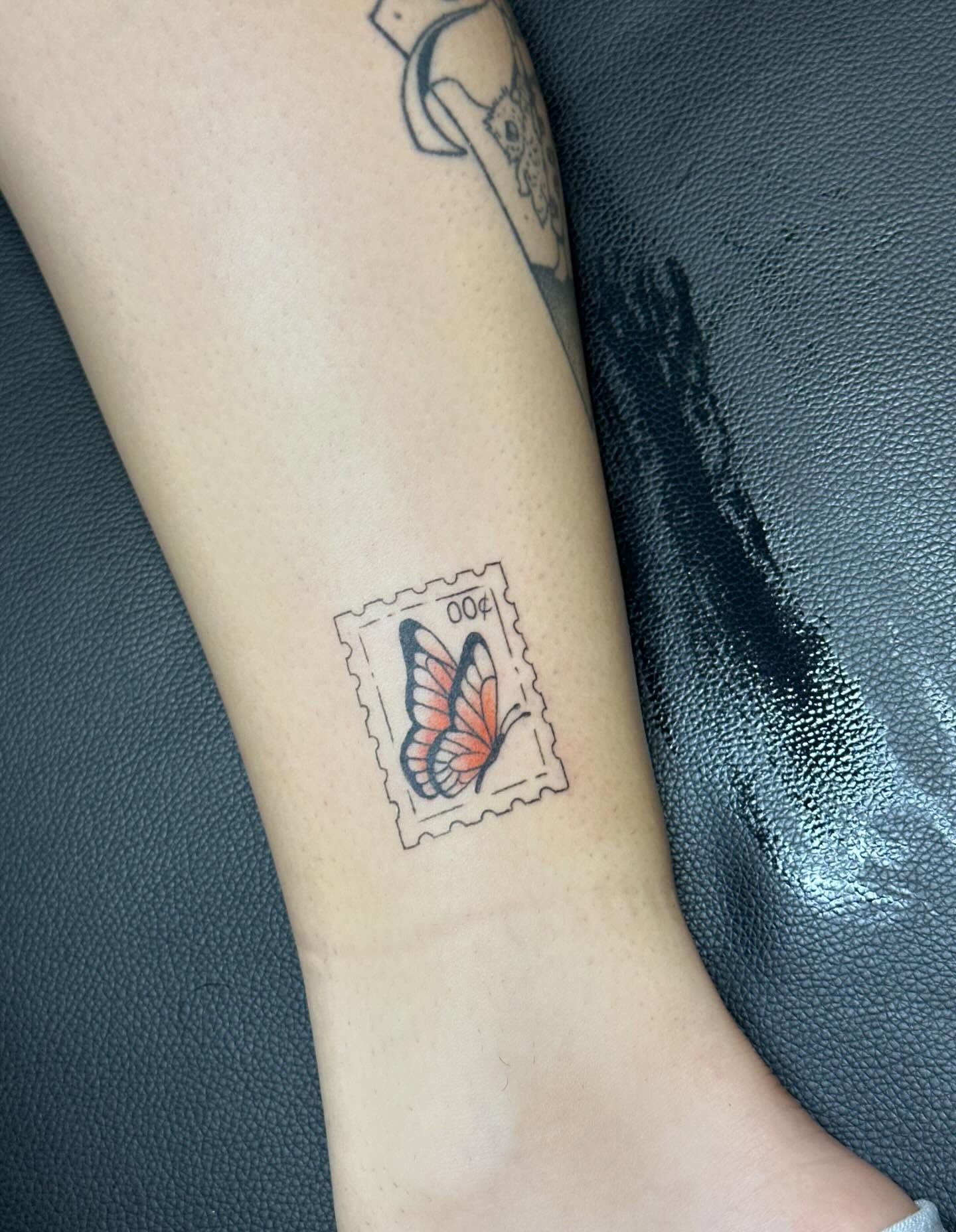 Butterfly postage stamp dotwork tattoo on the forearm by Kerri Colello Sittenauer