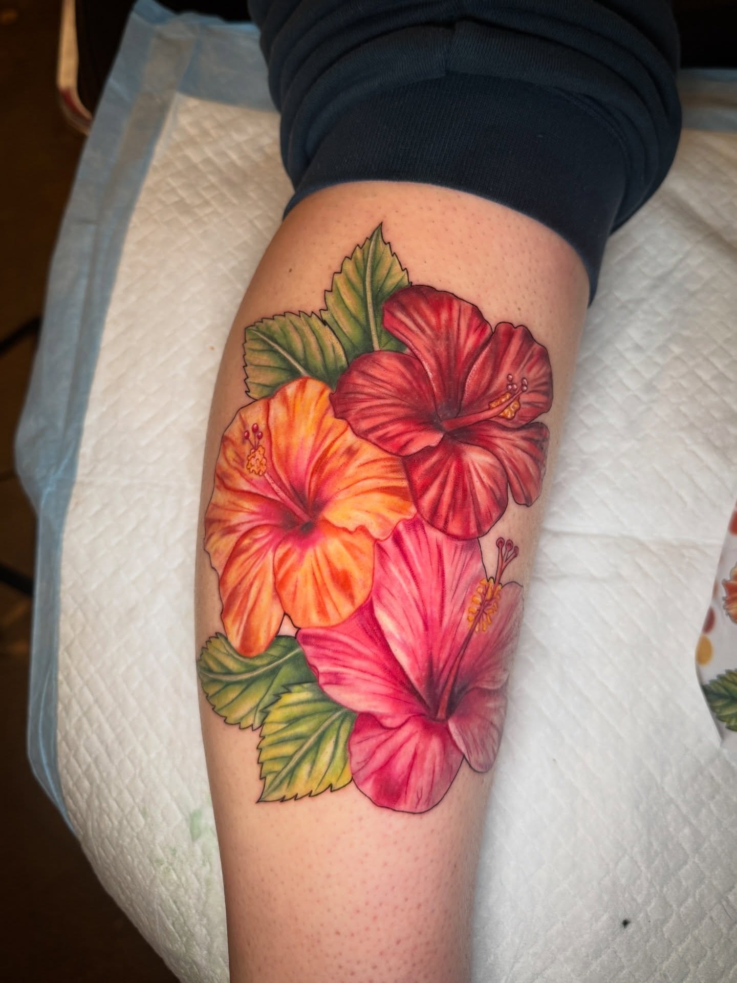Hibiscus flowers realism tattoo on the thigh by ✨Syreena✨
