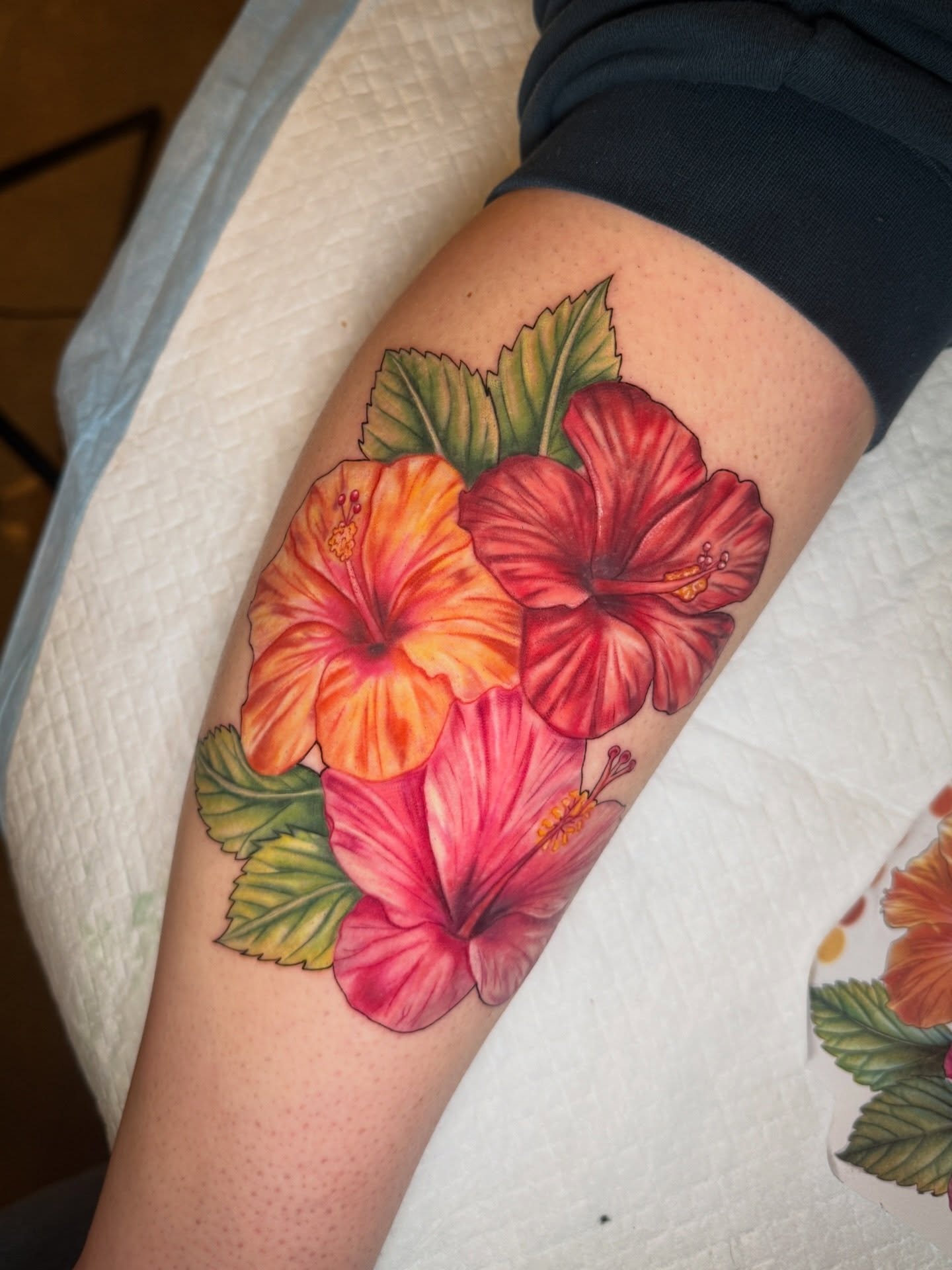 Hibiscus flowers realism tattoo on the thigh by ✨Syreena✨