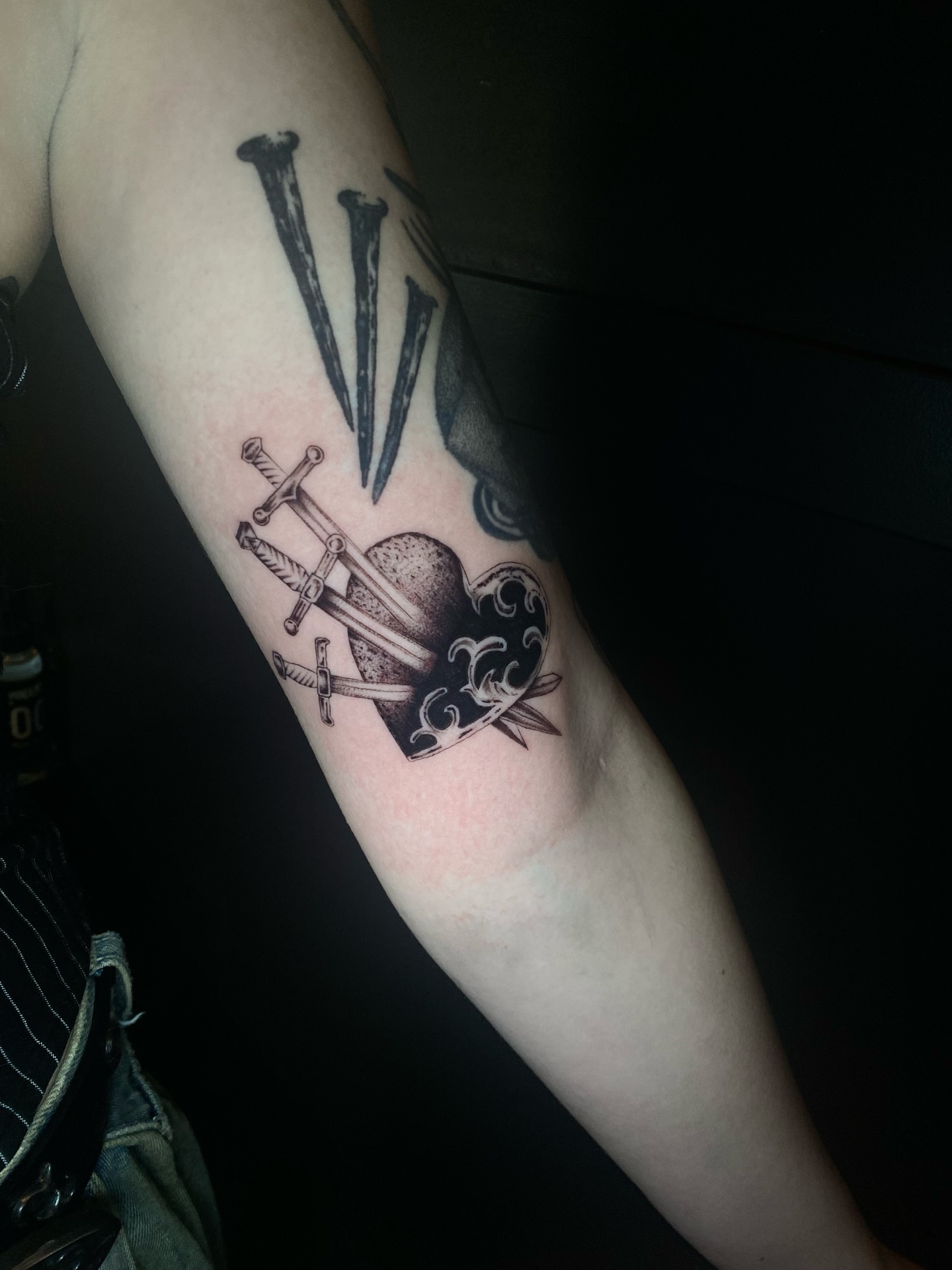 Nails and skull black and grey tattoo on the forearm by Cherry Jane 🍒
