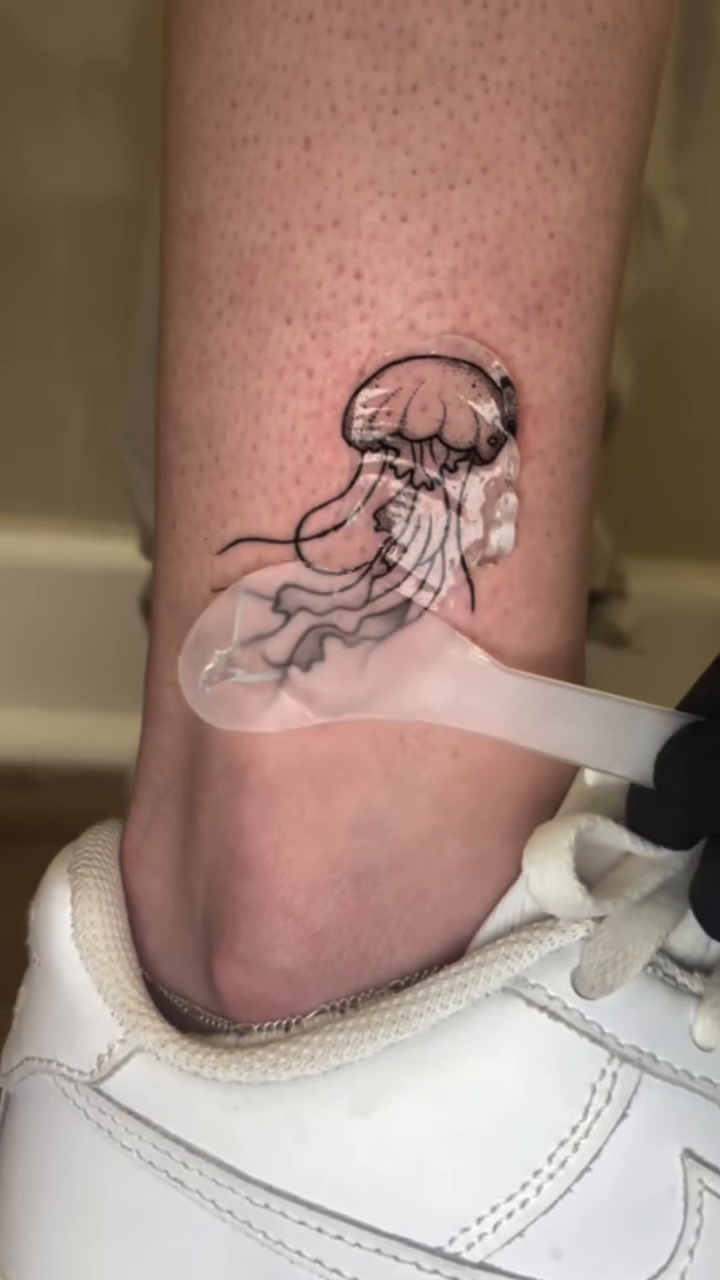 Jellyfish tattoo fine line tattoo on the leg by Danny Garcia