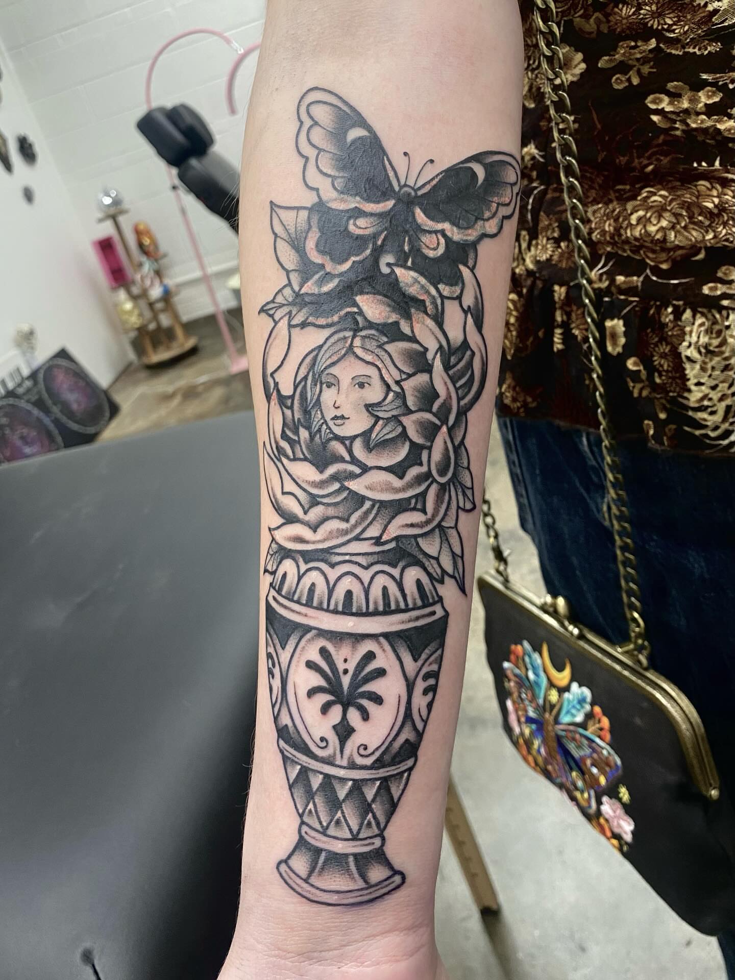 Woman with butterfly realism tattoo on the forearm by Jonah