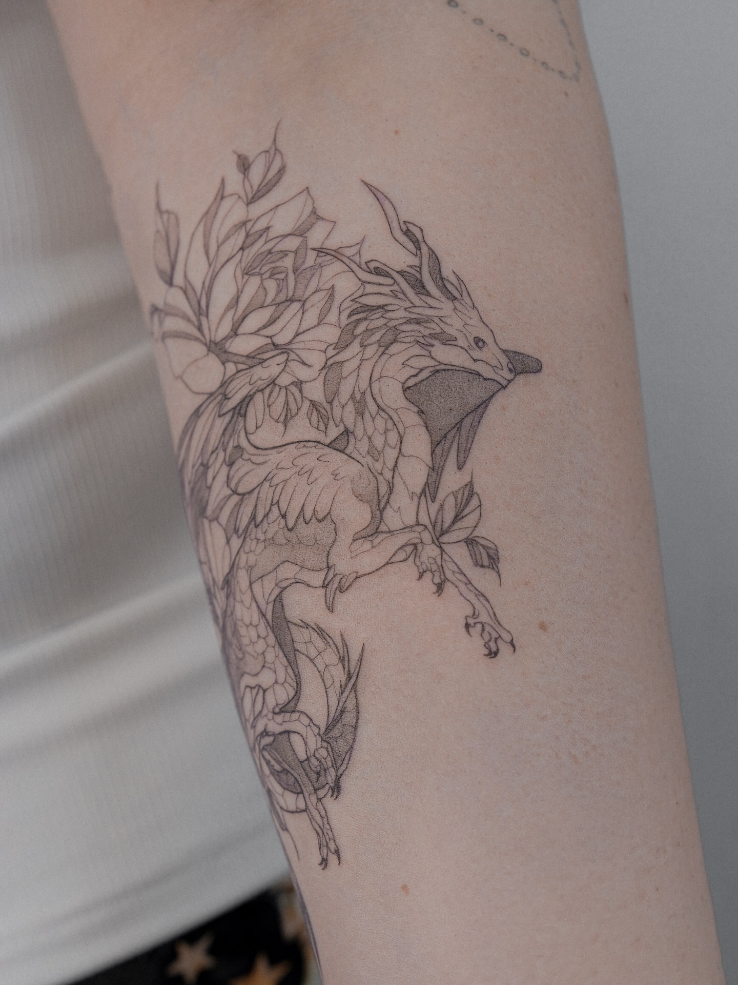Dragon black and grey tattoo on the forearm by Tattoo in Charlotte NC, Charlotte, North Carolina