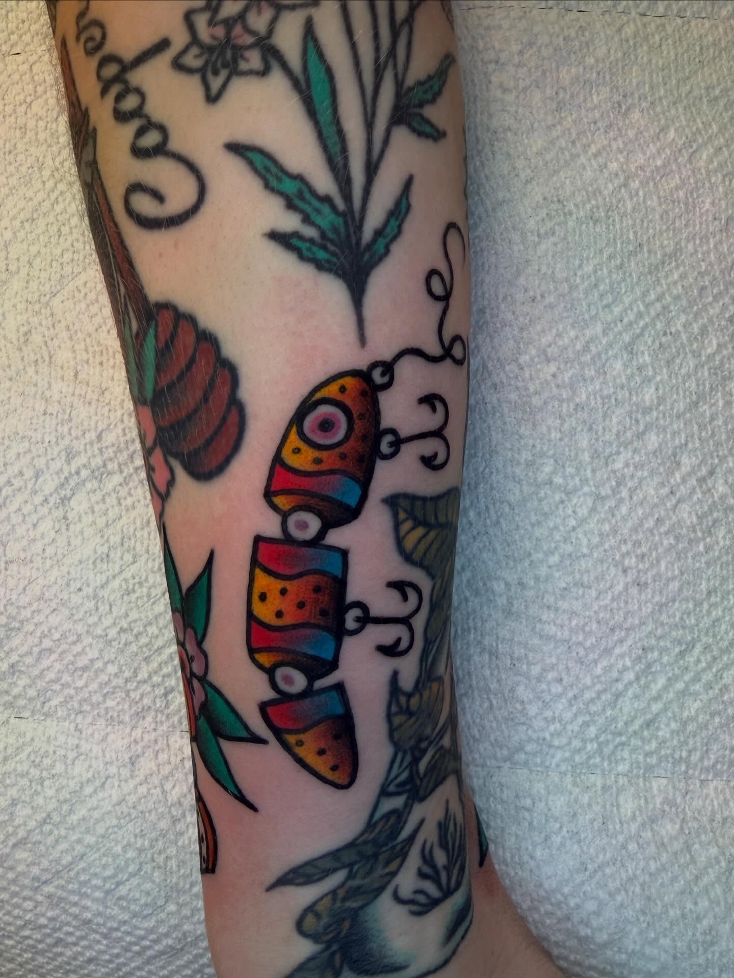 Butterfly American traditional tattoo on the forearm by Atom Aker