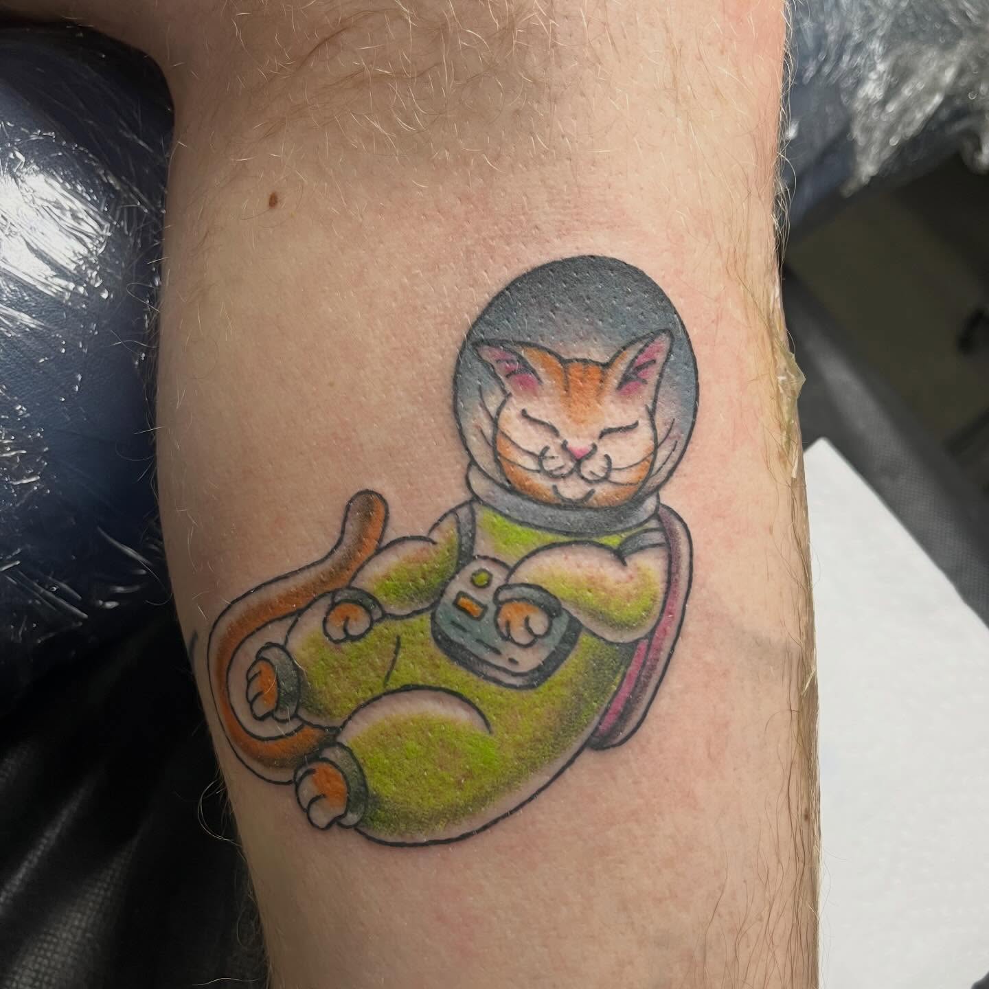 Cat astronaut new school tattoo on the forearm by Chase Healey, Salt Lake City, Utah