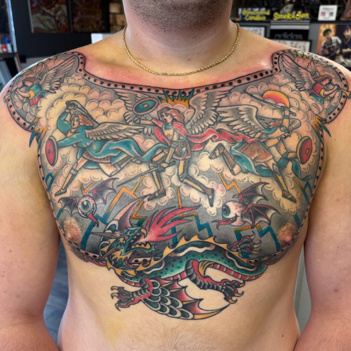 Mythical battle scene American traditional tattoo on the chest by Scottbarrytattoos@gmail.com