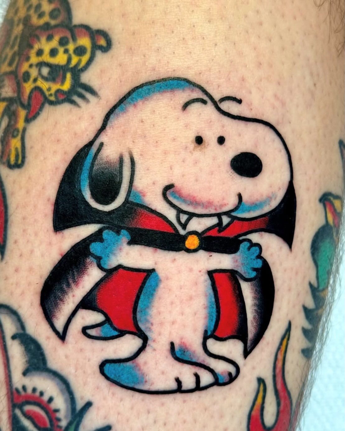Snoopy American traditional tattoo on the forearm by Joe Bear Tattooer