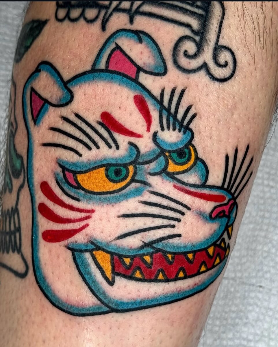 Cat American traditional tattoo on the forearm by Joe Bear Tattooer