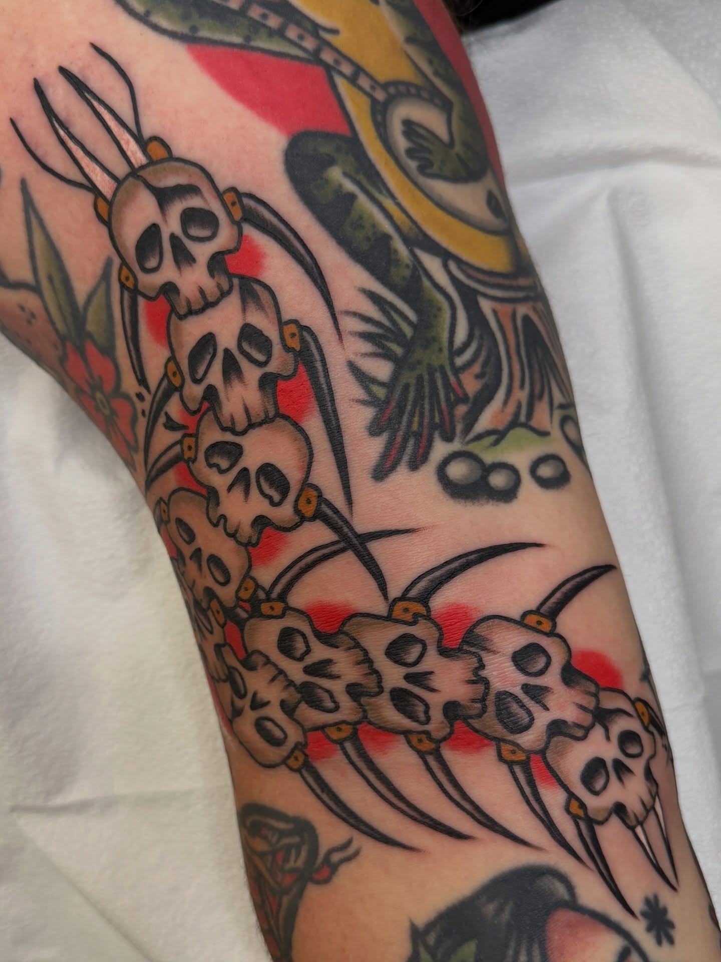 Skulls and pitchforks American traditional tattoo on the forearm by Cory Craft