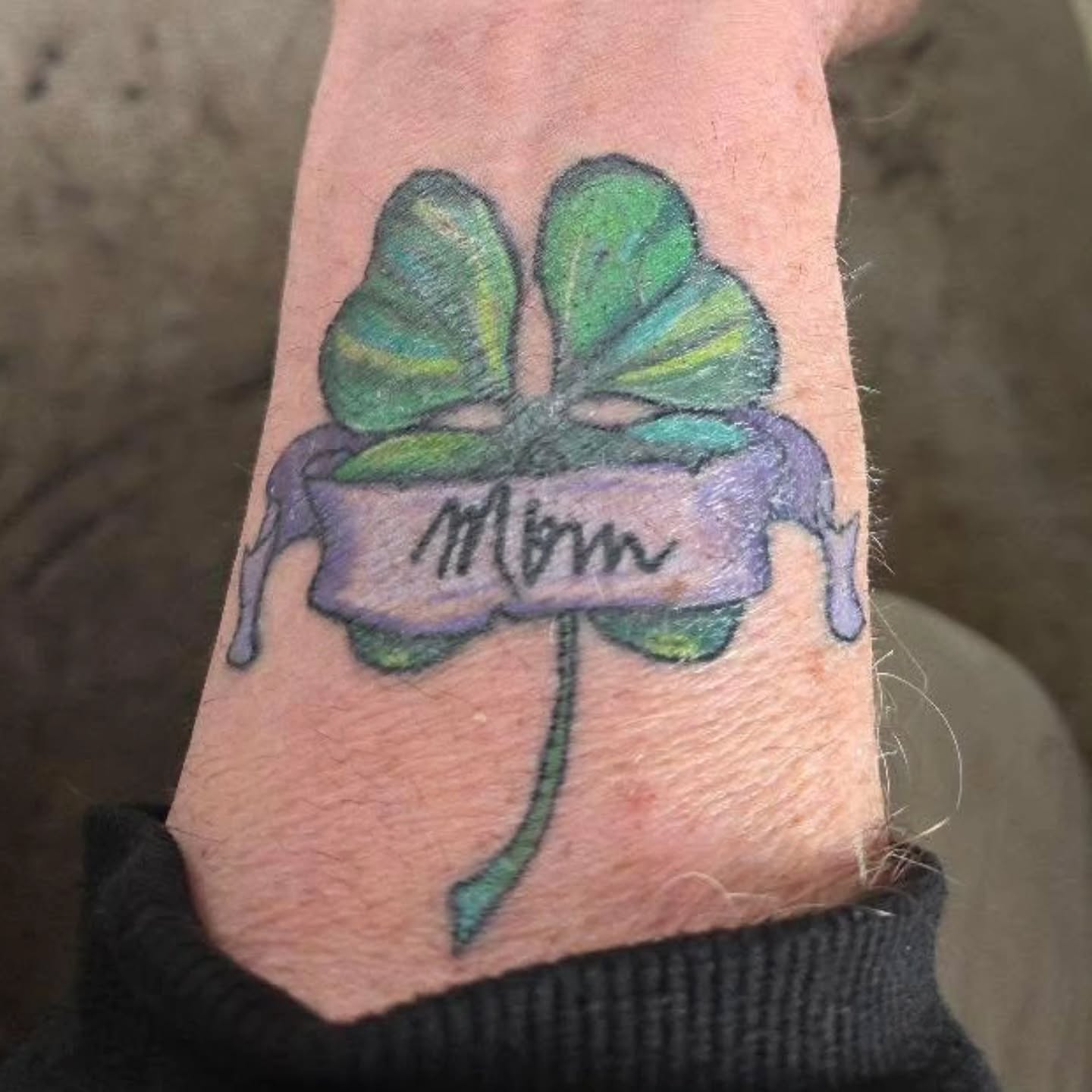 Clover with banner American traditional tattoo on the forearm by Collin Squire - YYC Tattoo Artist