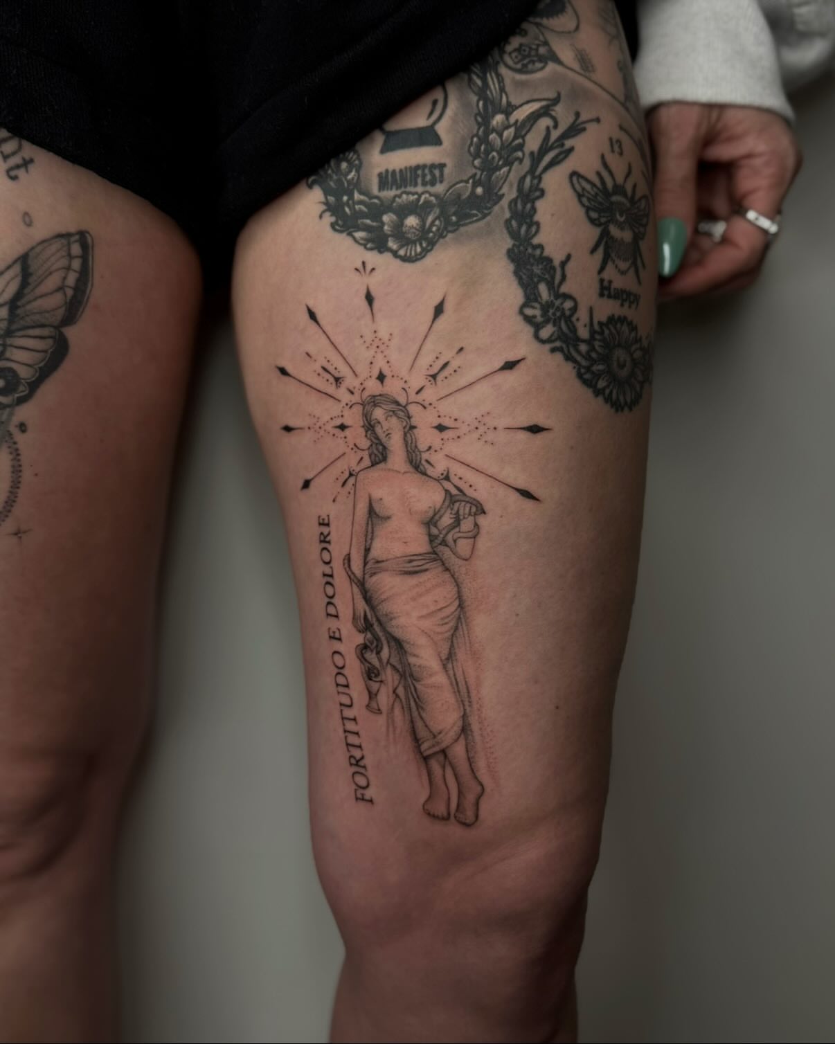 Statue of woman black and grey tattoo on the thigh by Carson Mccullers ✨