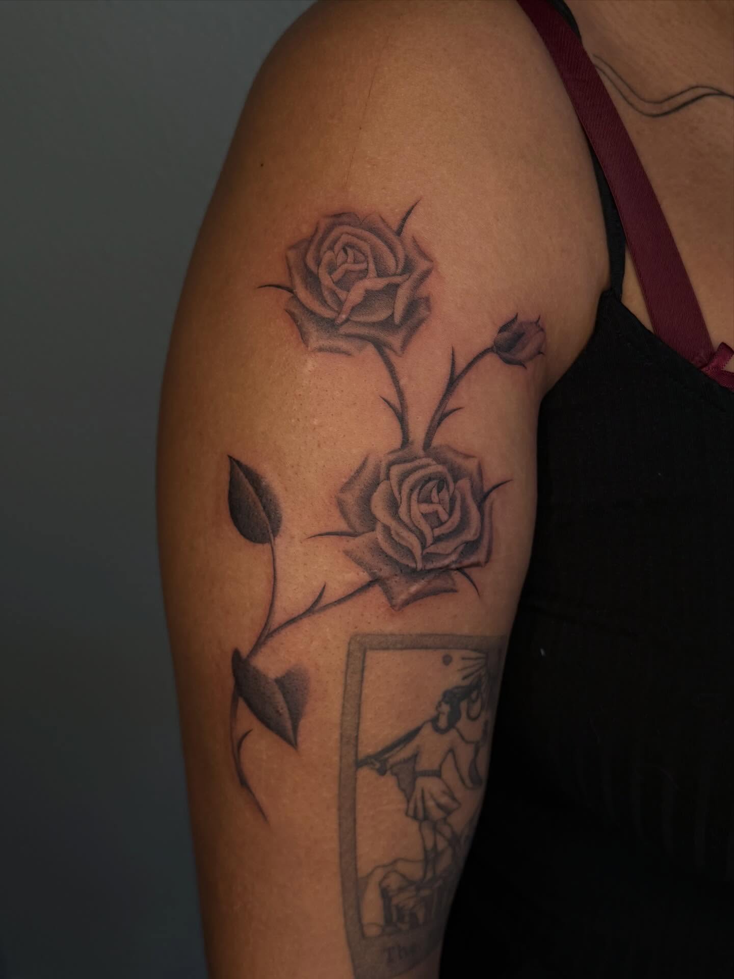 Roses realism tattoo on the upper arm by Nayoung, San Francisco, California