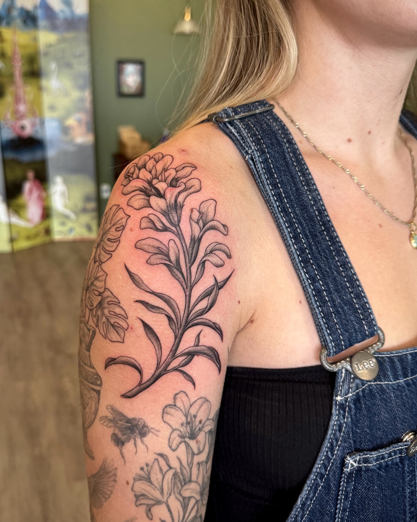Lily black and grey tattoo on the shoulder by Nichole Lorence