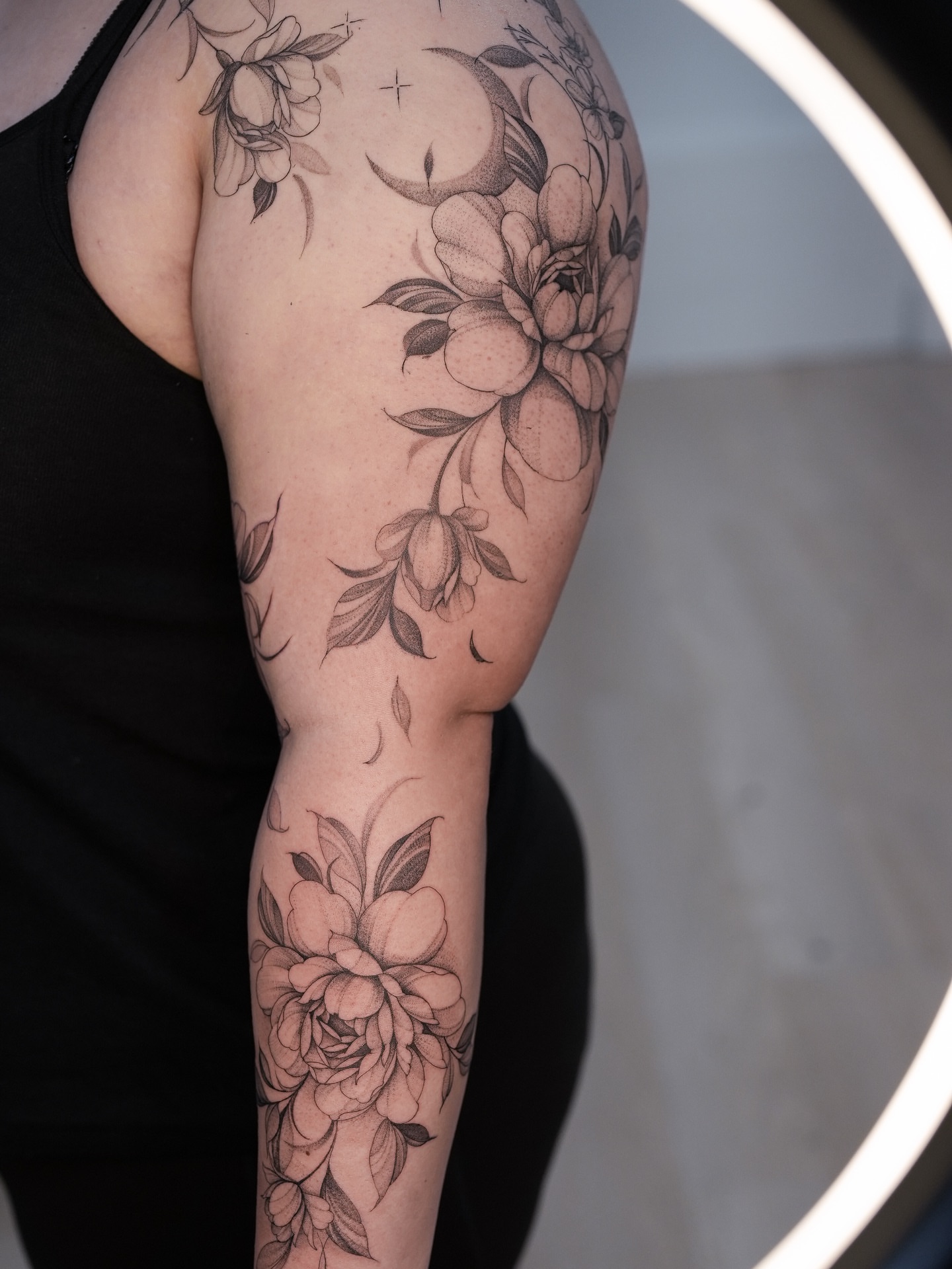 Floral bouquet black and grey tattoo on the forearm by X