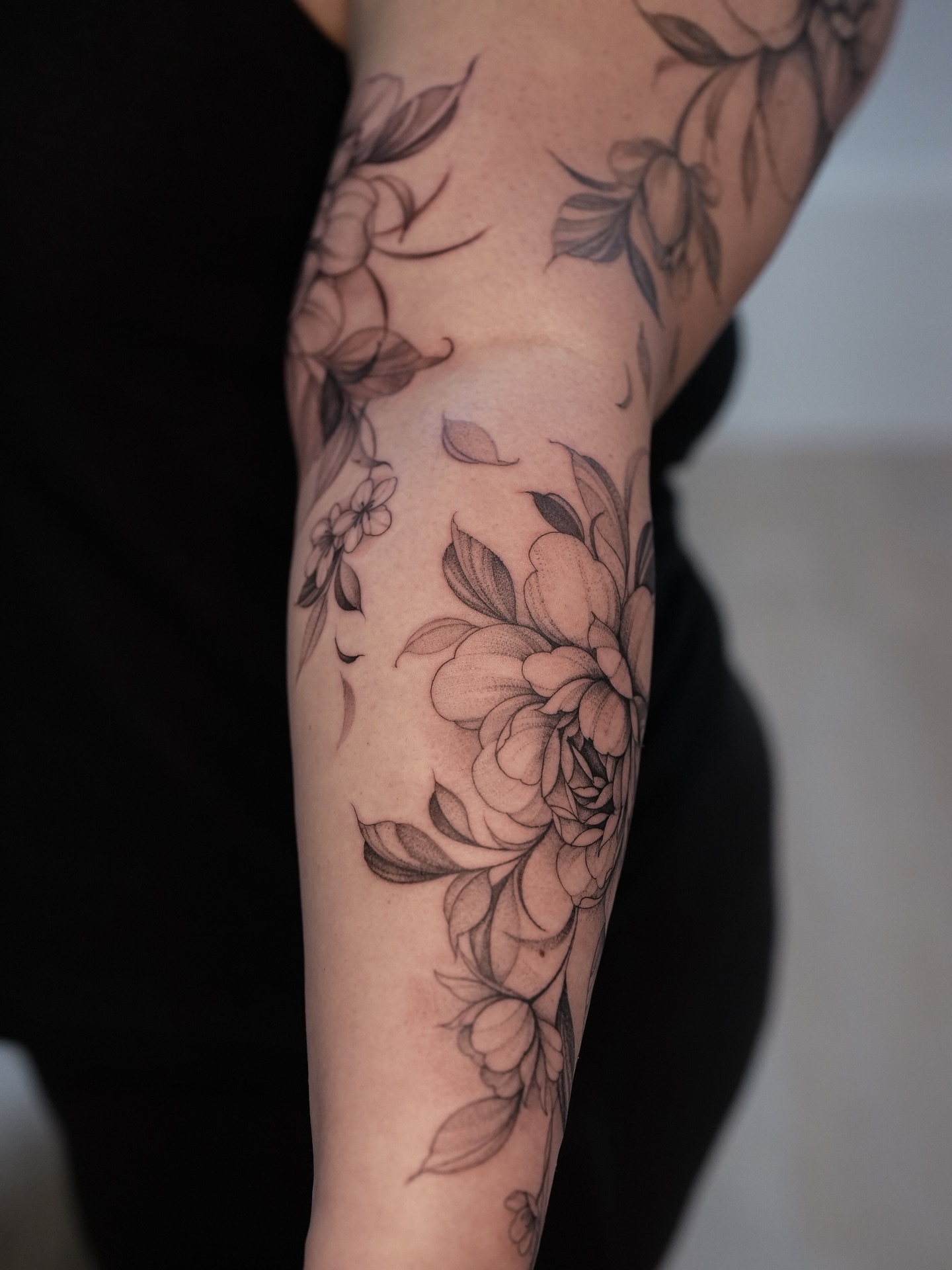 Floral bouquet black and grey tattoo on the forearm by X